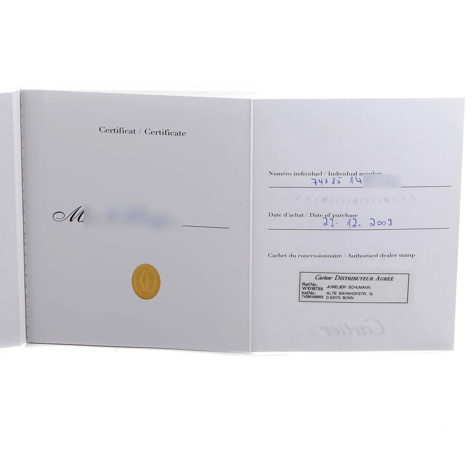 The image shows an open warranty or certificate document for the Cartier Tank Solo W1018755 Women's Yellow Gold Silver Dial watch.