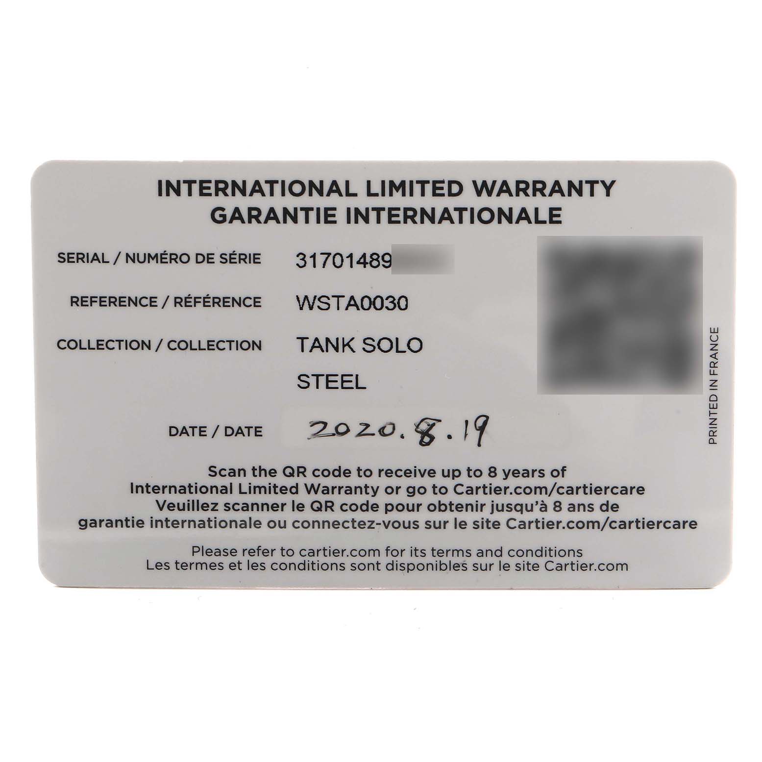 This image shows the international limited warranty card for the Cartier Tank Solo WSTA0030 Women's Stainless Steel Silver Dial model.