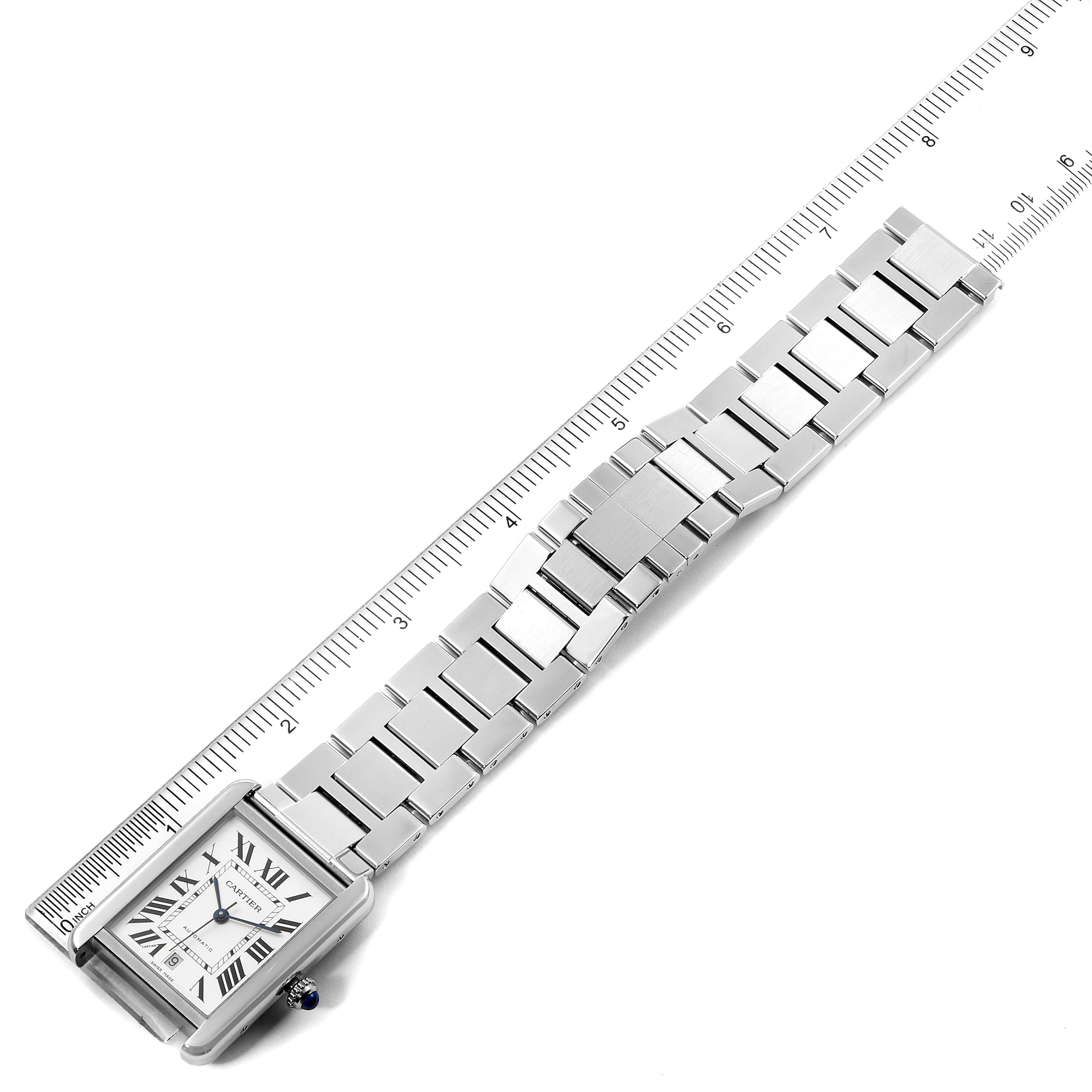 The Cartier Tank Solo W5200028 Men's Stainless Steel Silver Dial W5200028 Men's Stainless Steel Silver Dial watch is displayed diagonally with its rectangular face and metal bracelet against a ruler backdrop.