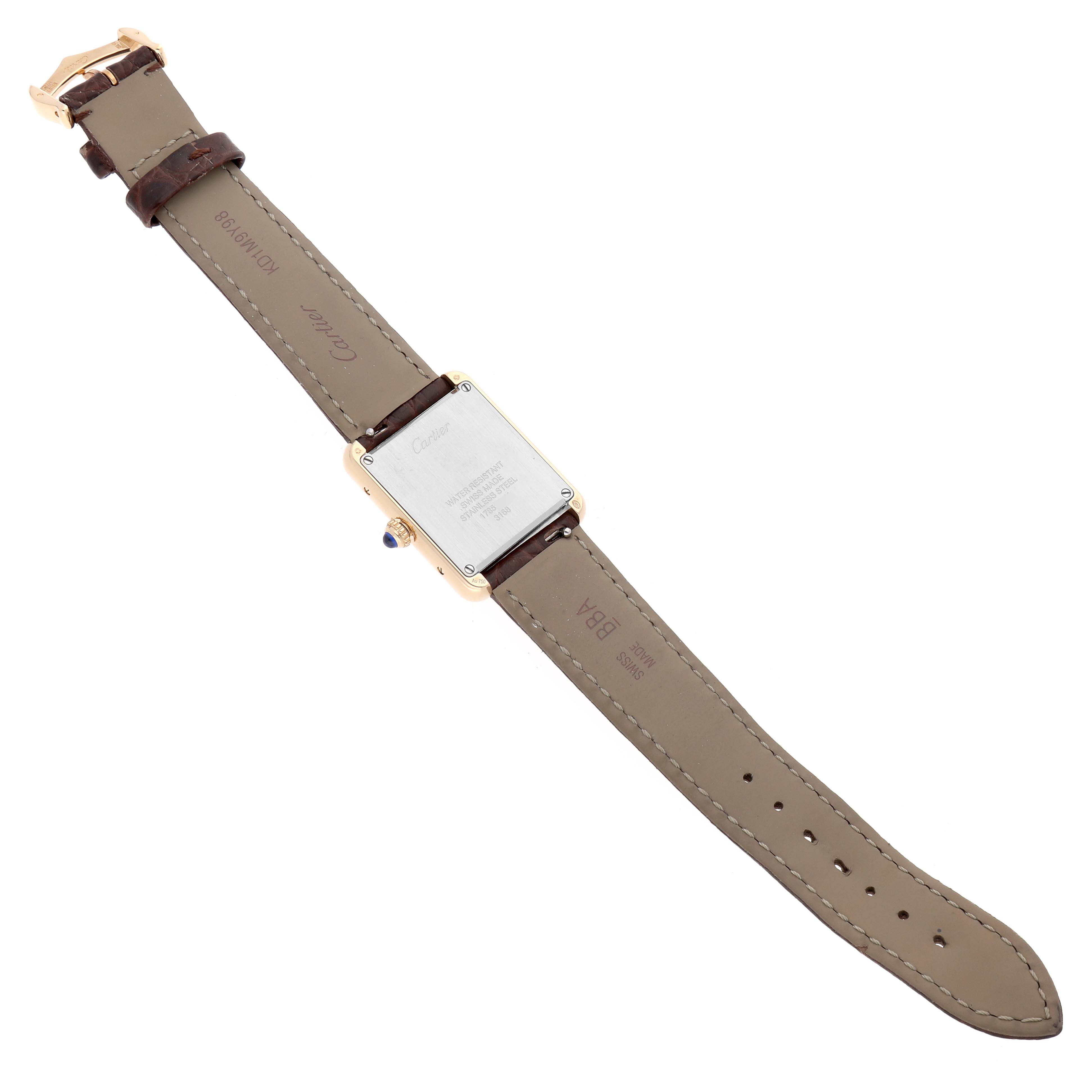 The image shows the back view of a Cartier Tank Solo W5200002 Women's Yellow Gold Silver Dial watch, highlighting the case back, strap, and buckle.