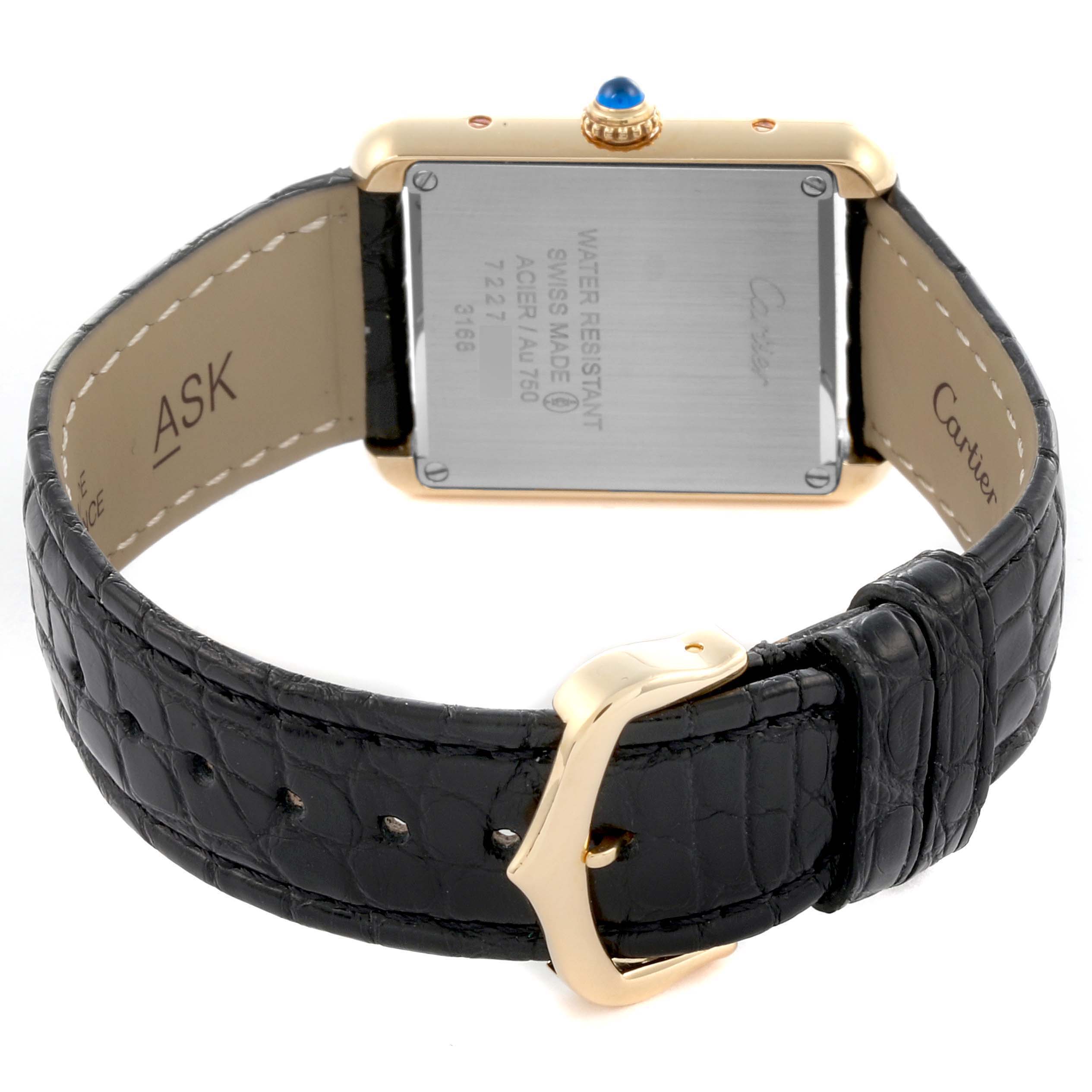 The Cartier Tank Solo W5200002 Women's Steel and Gold (two tone) Silver Dial W5200002 Women's Steel and Gold (two tone) Silver Dial watch is shown from the back, highlighting the case back and black leather strap with a gold buckle.