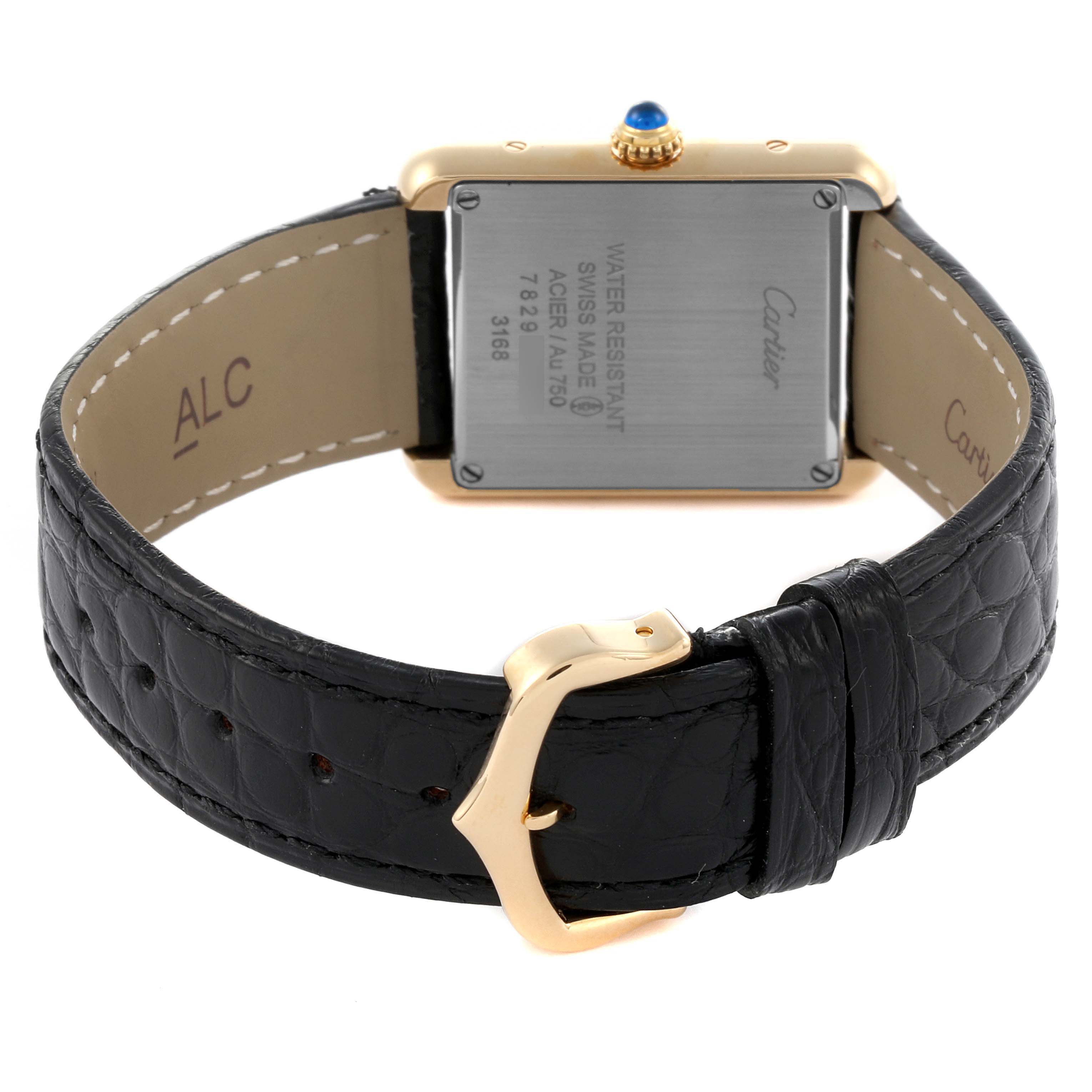 The image shows the back of a Cartier Tank Solo W5200002 Women's Steel and Gold (two tone) Silver Dial W5200002 Women's Steel and Gold (two tone) Silver Dial watch, highlighting the metal case back and leather strap with a buckle.