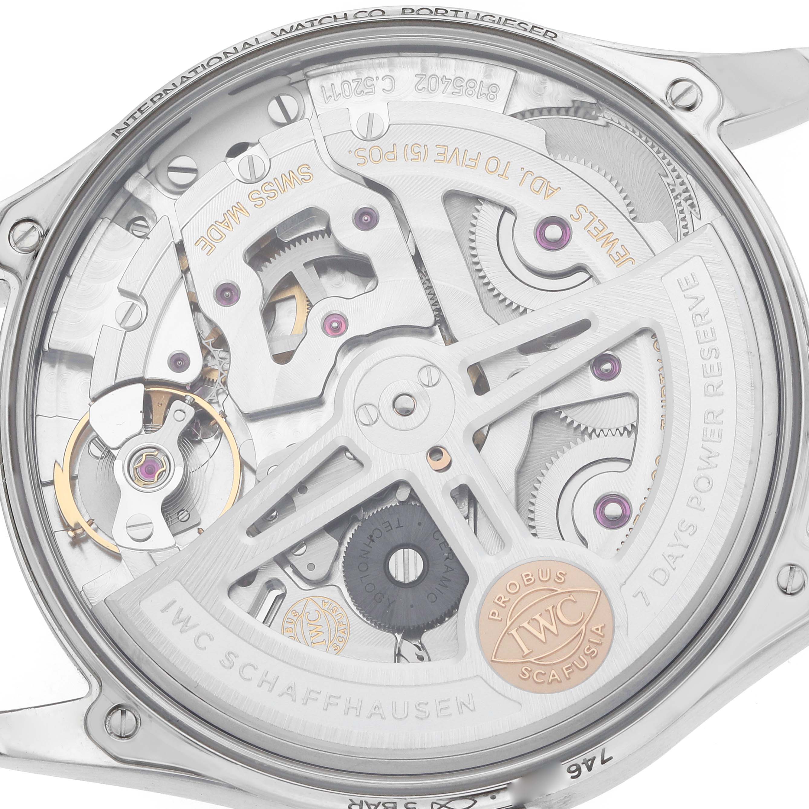 This image shows the intricate back view of the IWC Portuguese IW501705 Men's Stainless Steel Beige Dial watch, highlighting its movement and mechanical parts.