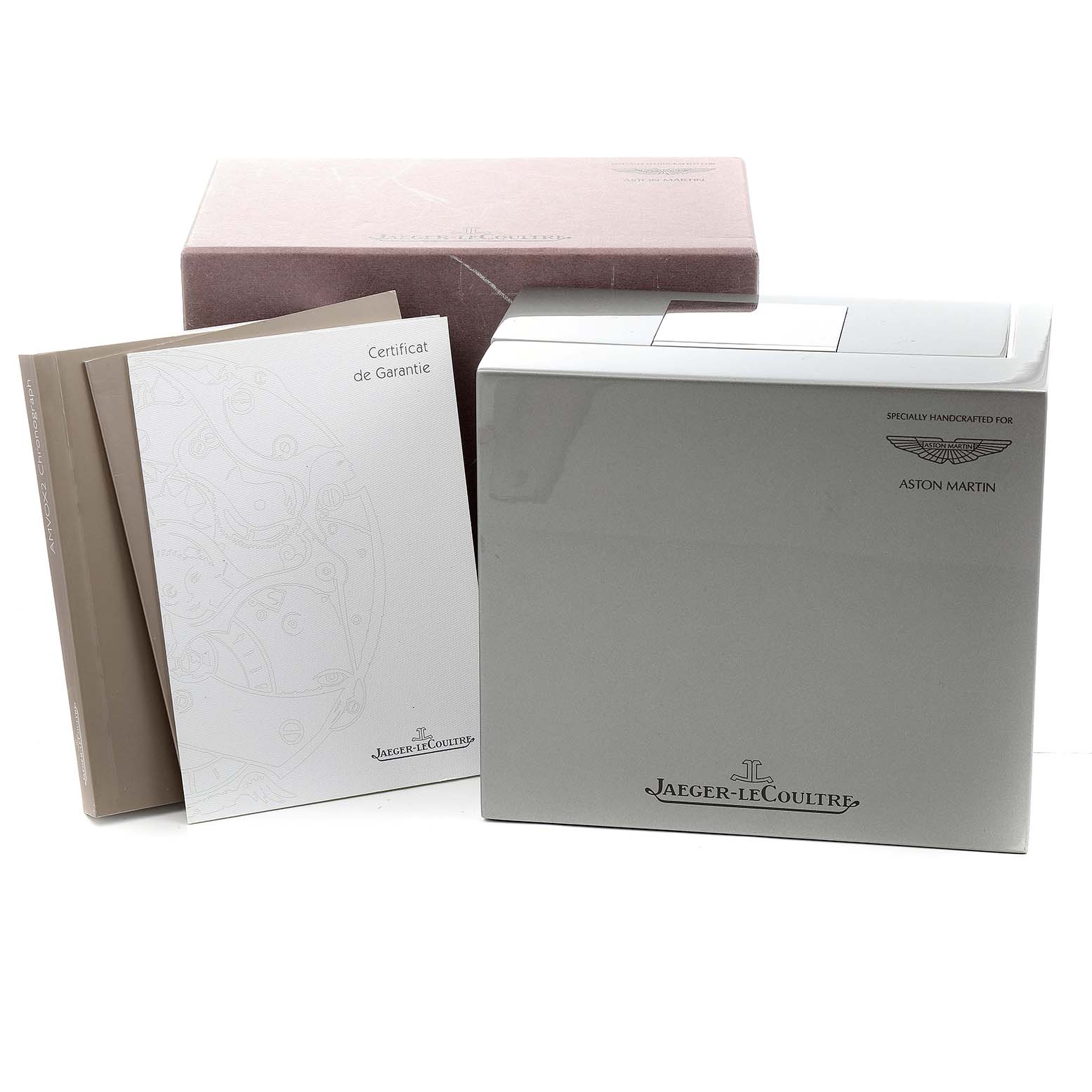 This image shows the packaging and documentation for the Jaeger-LeCoultre Amvox watch, including a box, warranty certificate, and manuals.