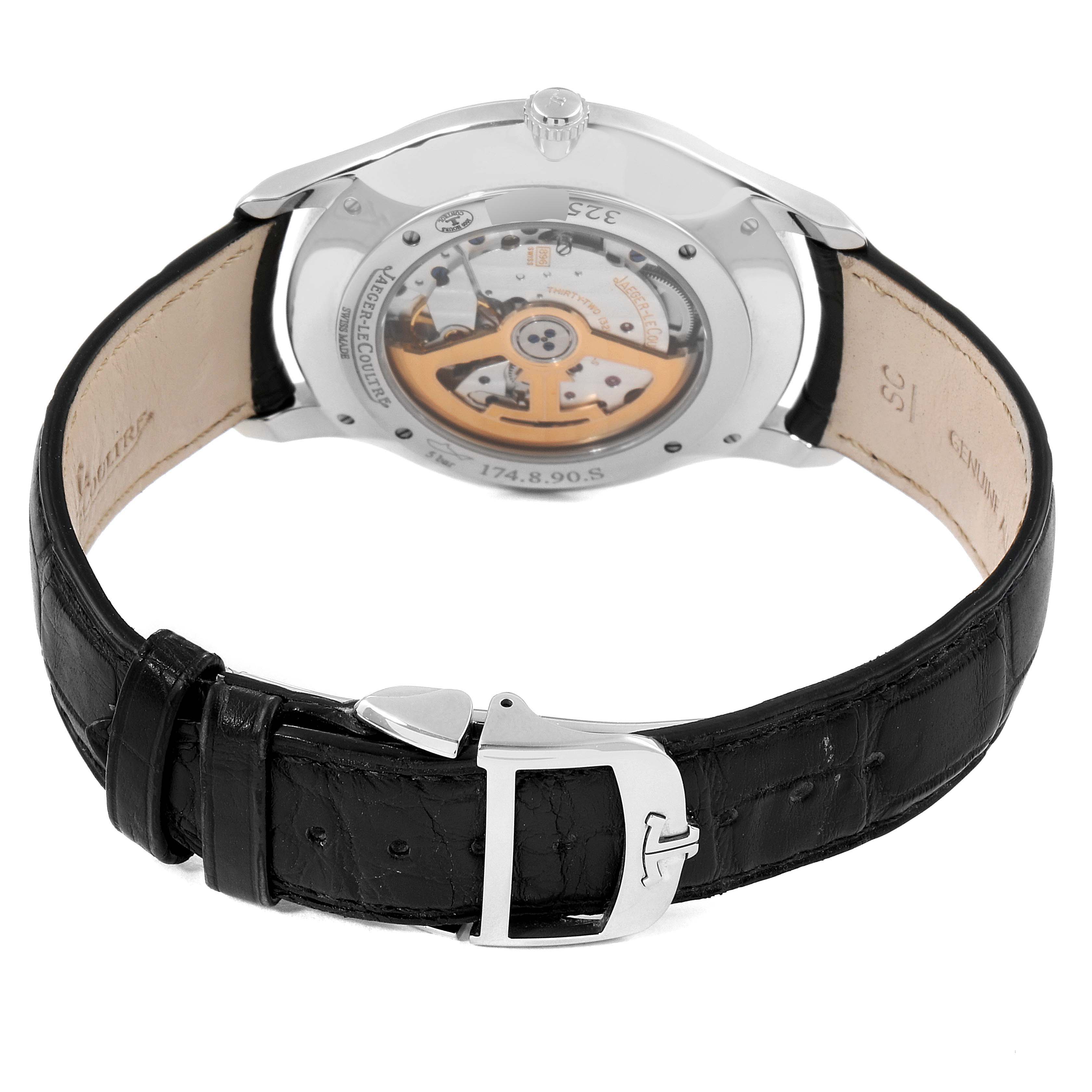The image shows the back view of a Jaeger-LeCoultre Master model watch, highlighting the open case back and black leather strap.