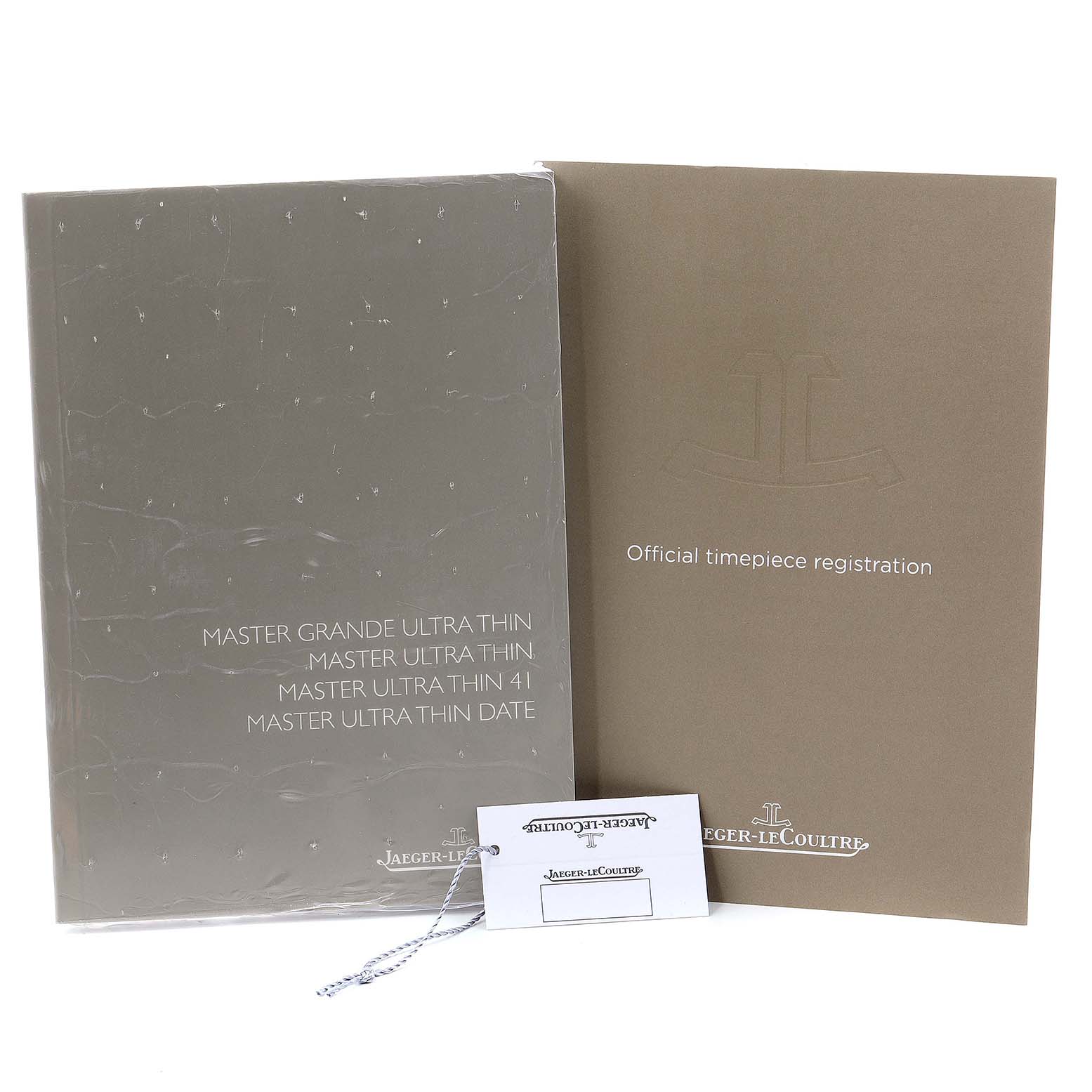 The image shows instruction booklets and a registration card for the Jaeger-LeCoultre Master model watch.