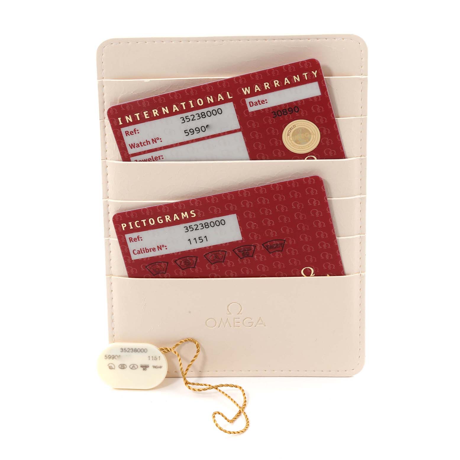 The image shows warranty cards and an Omega tag for the Omega Speedmaster 3523.80.00 Men
s Stainless Steel Blue Dial 3523.80.00 Men
s Stainless Steel Blue Dial watch placed in a white cardholder.