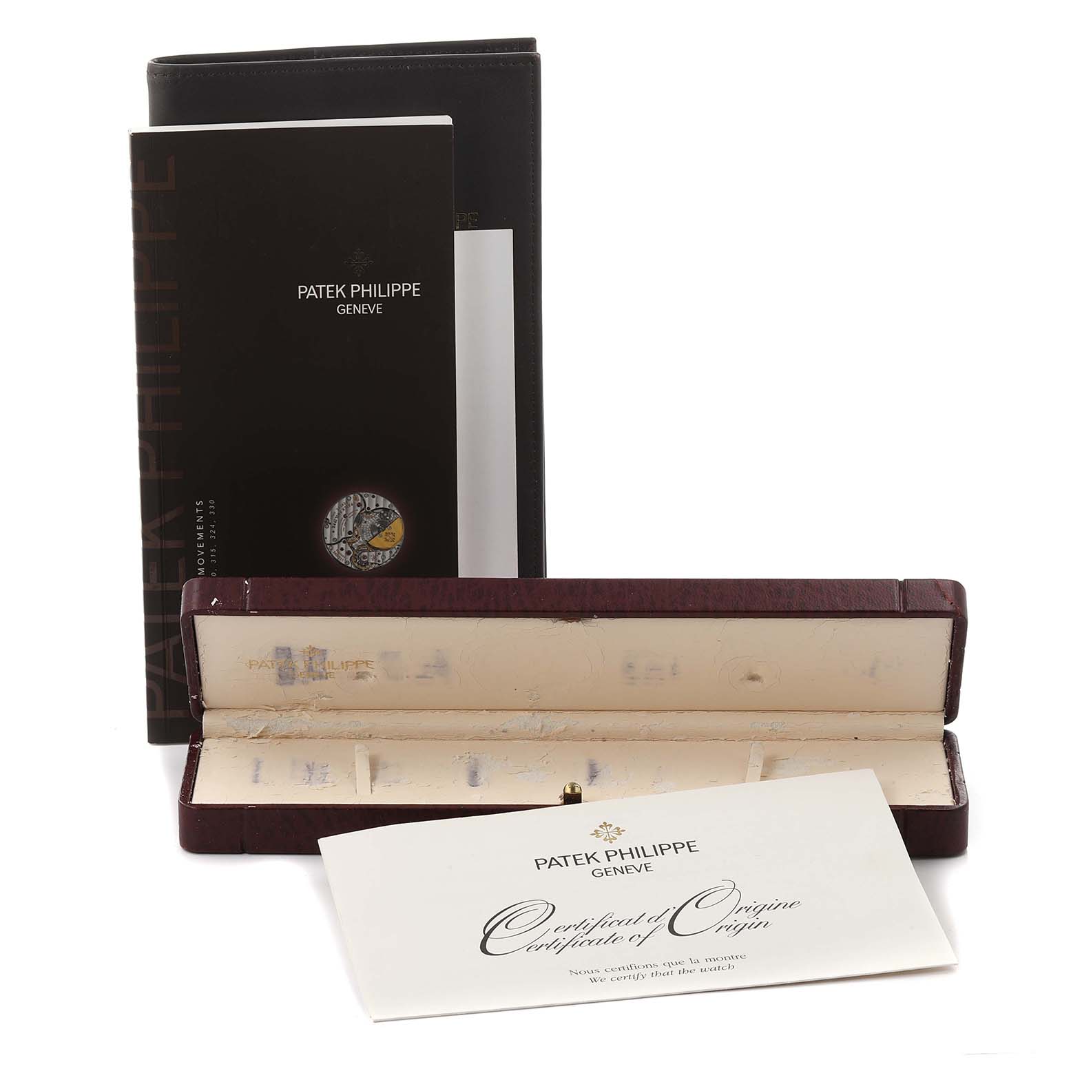 The image shows Patek Philippe Calatrava 5120G-001 Men's White Gold White Dial 5120G-001 Men's White Gold White Dial model accessories, including a box, booklet, and certificate.