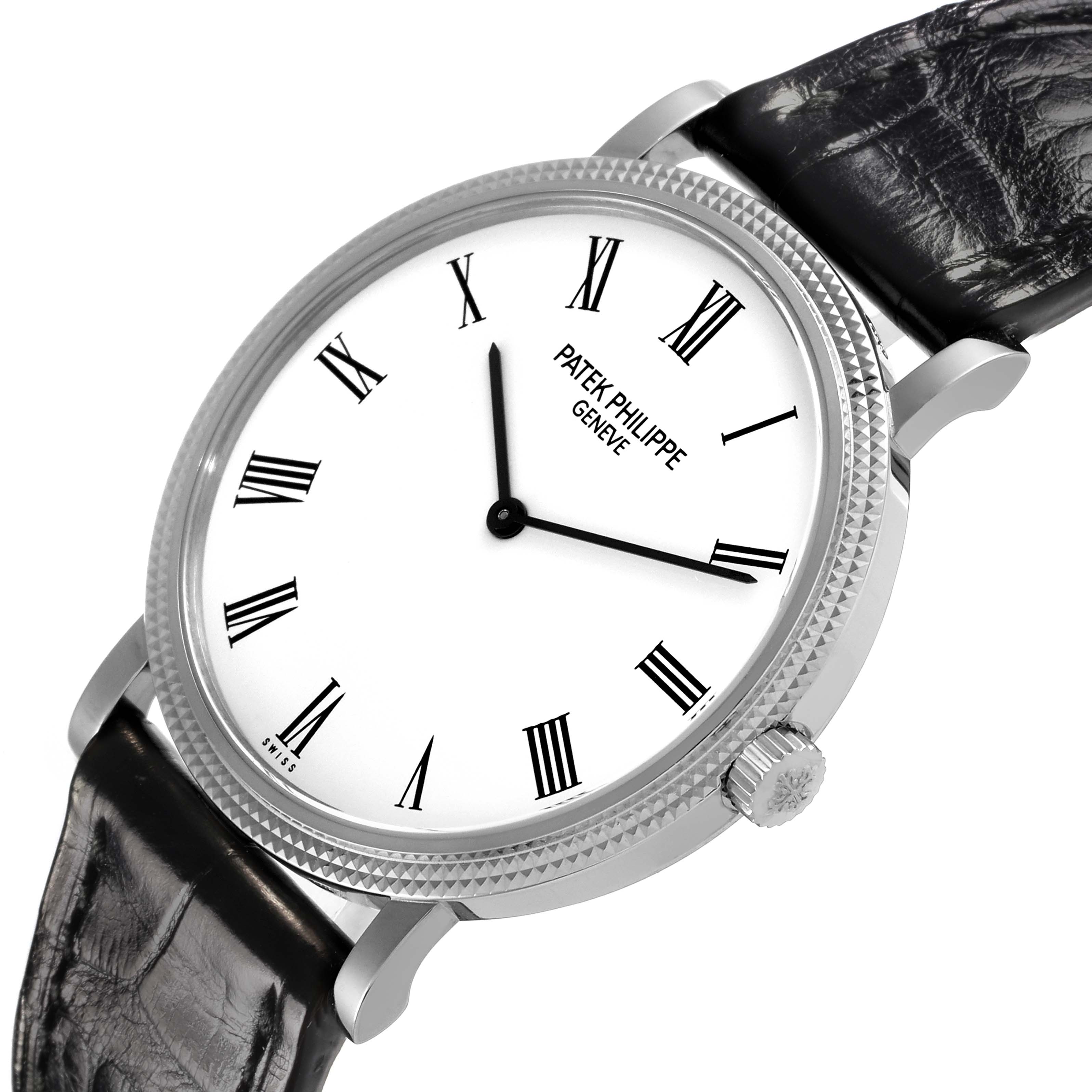 The Patek Philippe Calatrava 5120G-001 Men's White Gold White Dial 5120G-001 Men's White Gold White Dial watch is shown at an angle highlighting the dial, bezel, crown, and leather strap.