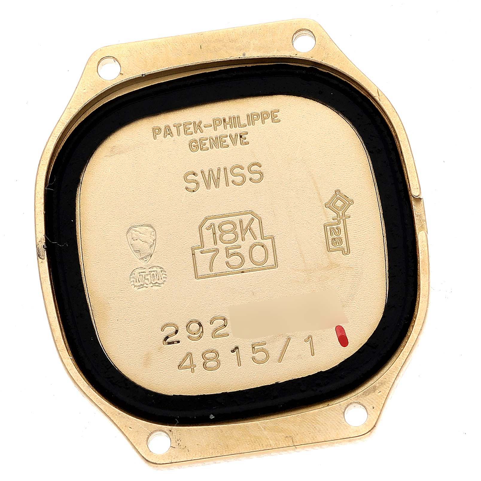 The image shows the golden case back of a La Flamme model by Patek Philippe, featuring its hallmark and specified markings.