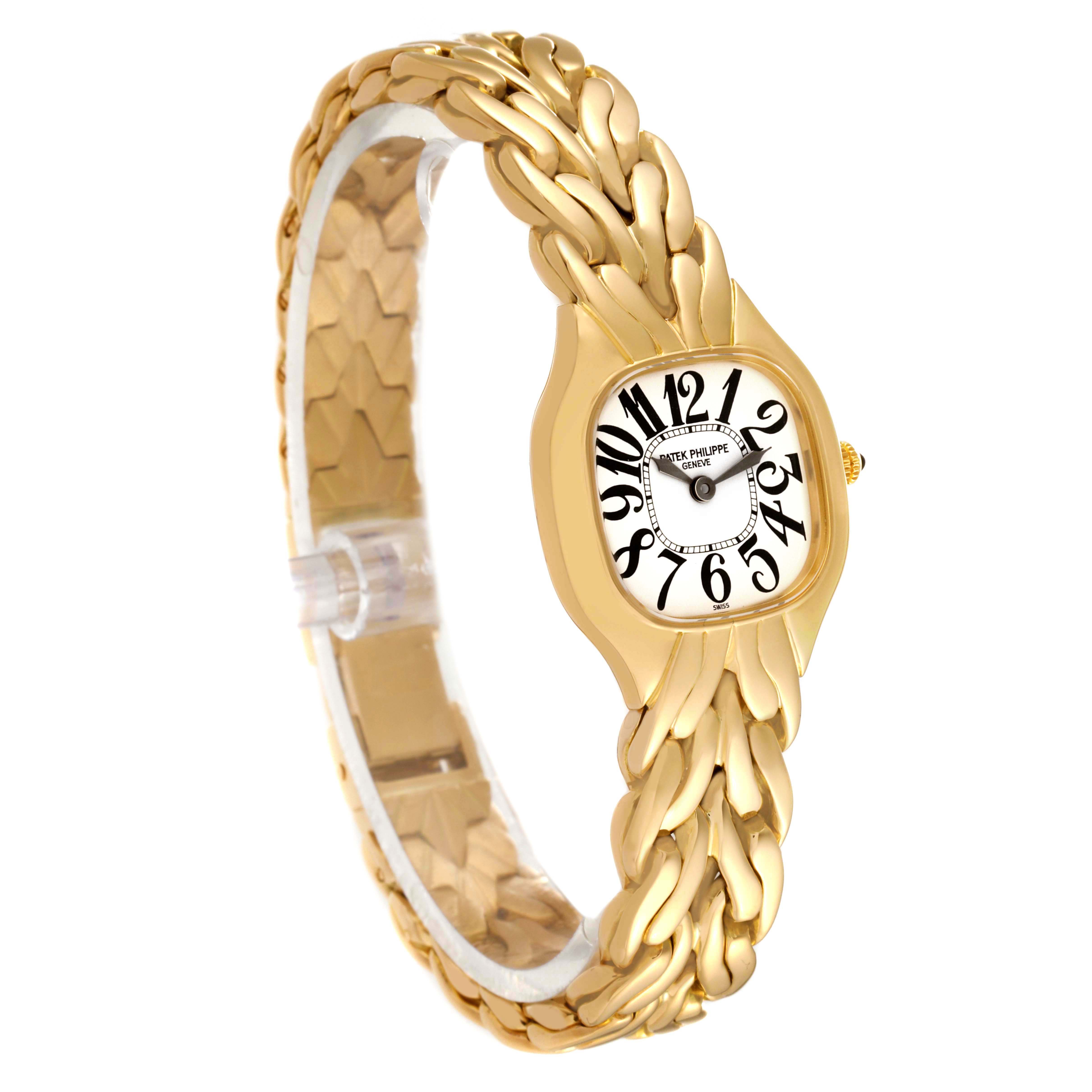 The image shows a side angle view of the gold La Flamme model by Patek Philippe, displaying the watch face and intricate band.