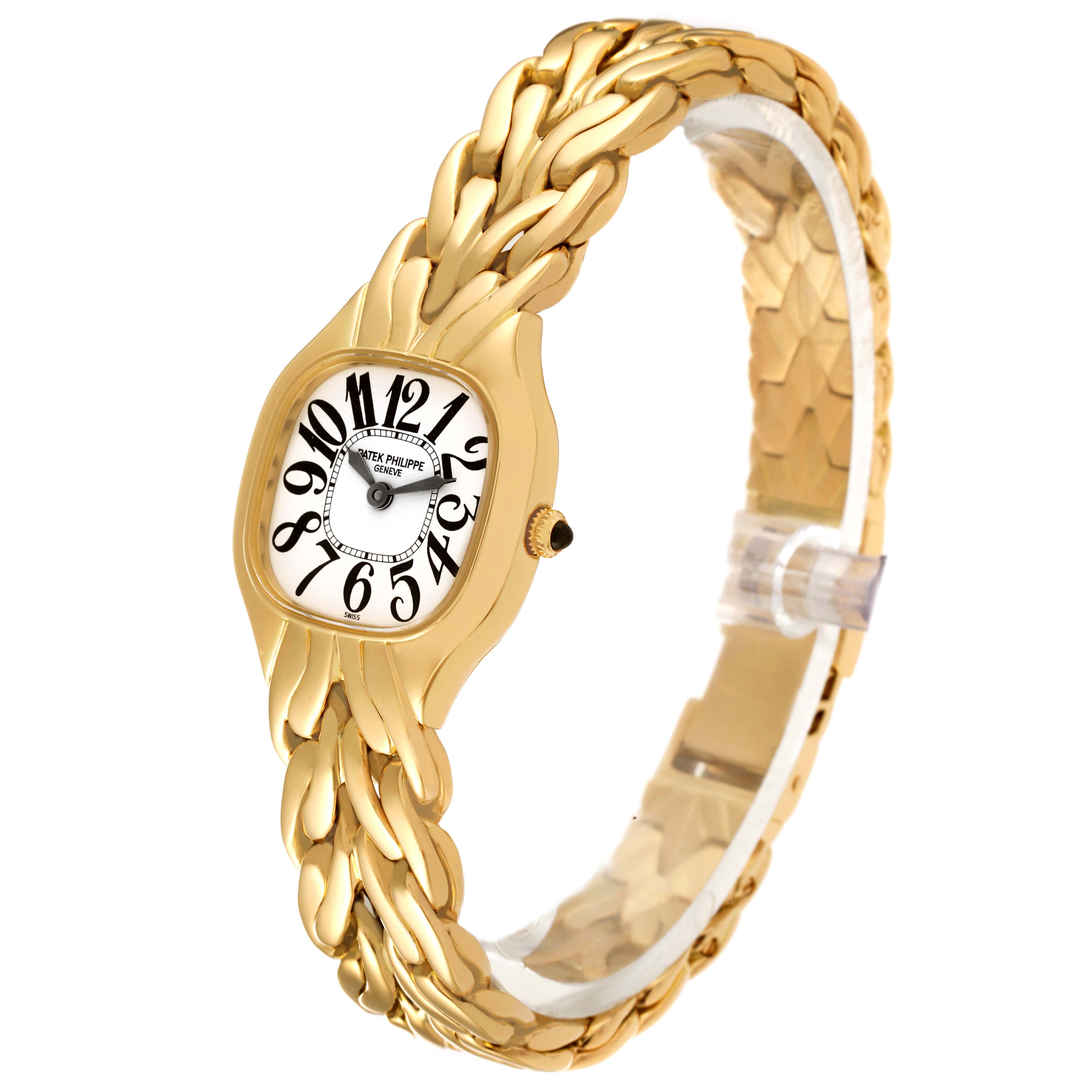 The image shows a gold La Flamme model by Patek Philippe from an angled top-front view, highlighting the watch face and braided band.