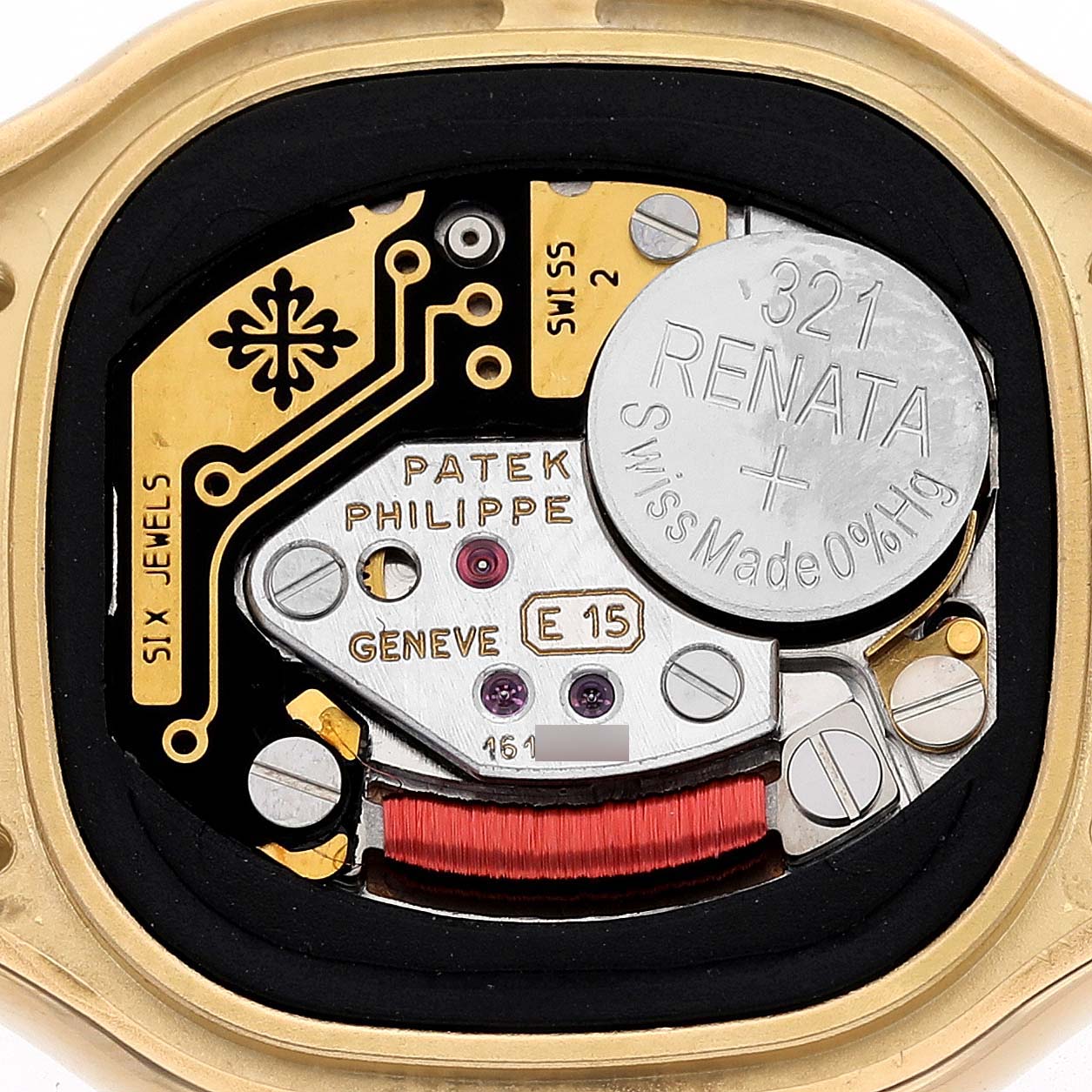 This image shows the internal components of a Patek Philippe La Flamme  4815/1J Women's Yellow Gold White Dial 4815/1J Women's Yellow Gold White Dialwatch, highlighting its movement parts and battery.