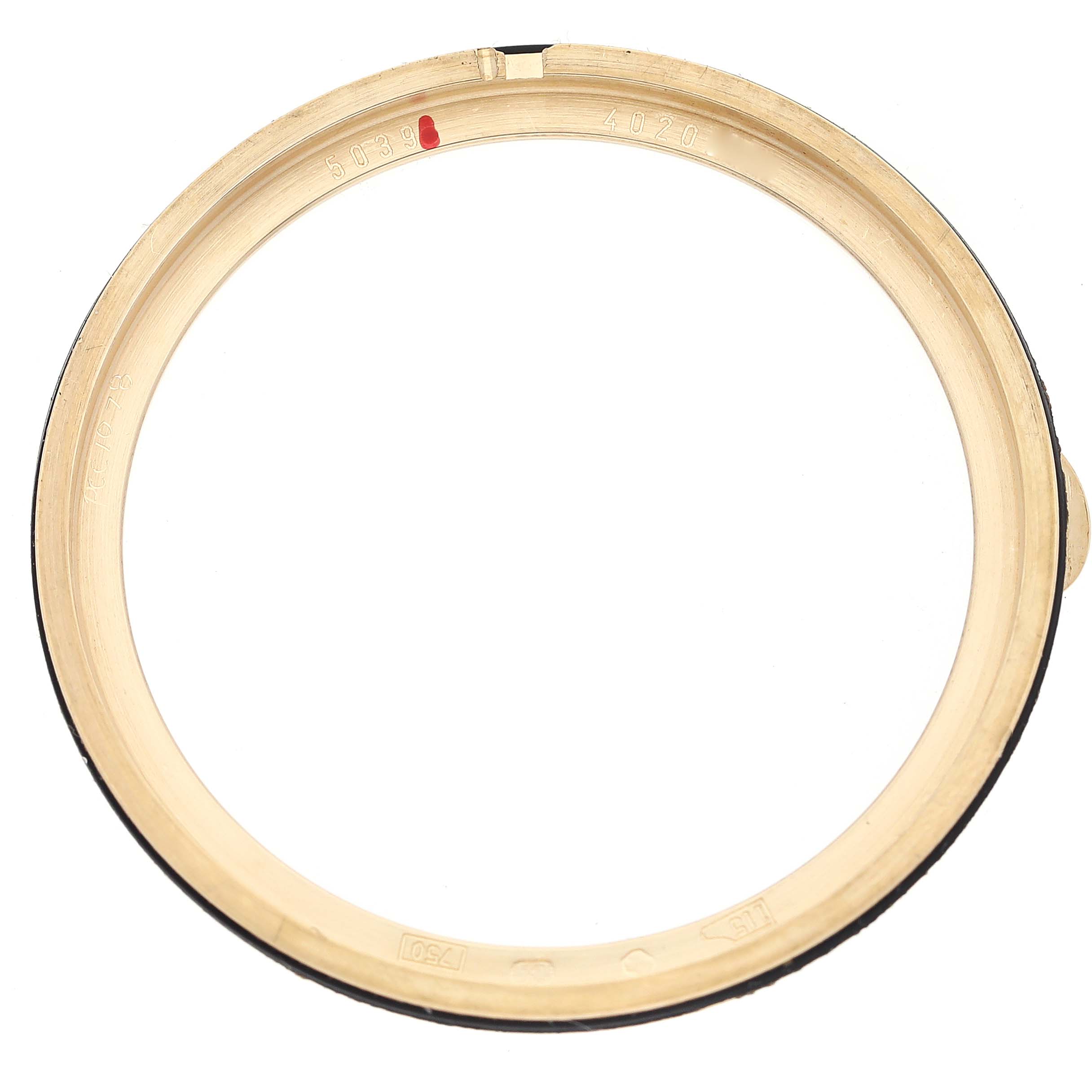 This image shows the bezel of a Patek Philippe Complications 5039J Men's Yellow Gold Silver Dial 5039J Men's Yellow Gold Silver Dial watch, viewed from a top-down angle.