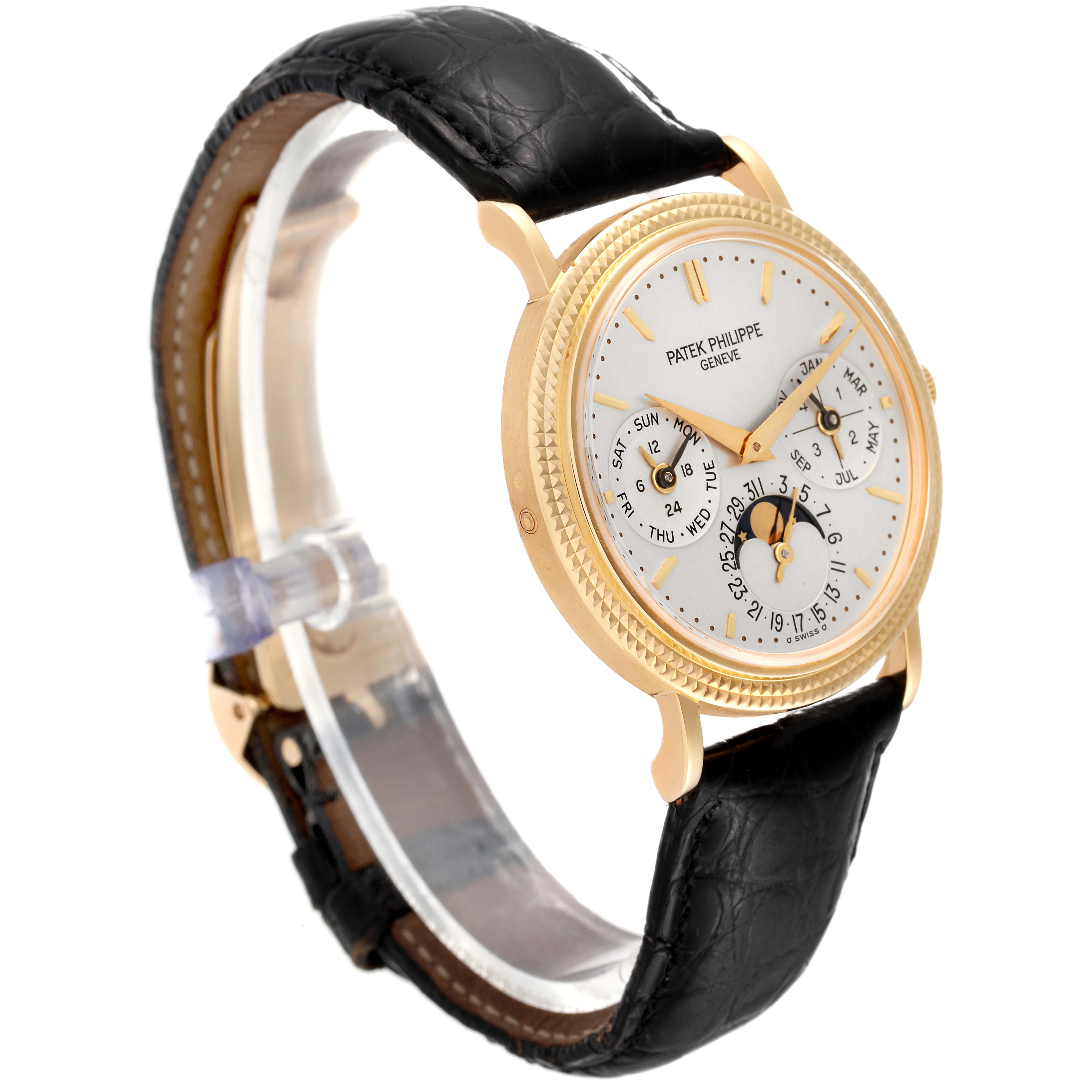 This image shows a Patek Philippe Complications 5039J Men's Yellow Gold Silver Dial 5039J Men's Yellow Gold Silver Dial model watch from a front-side angle, highlighting the dial and black leather strap.