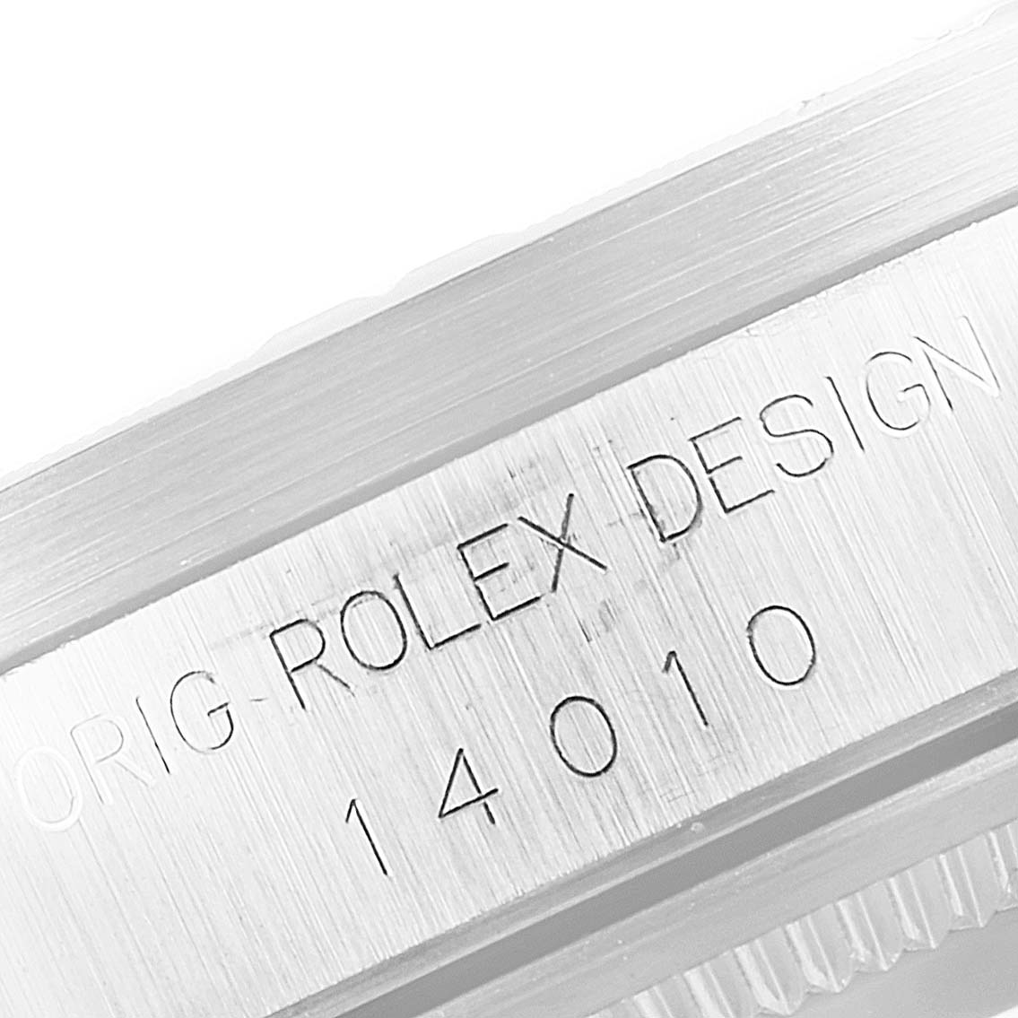 This image shows a close-up angle of the case side of the Rolex Air-King 14010 Men's Stainless Steel White Dial 14010 Men's Stainless Steel White Dial watch, highlighting the engraved design signature and model number.
