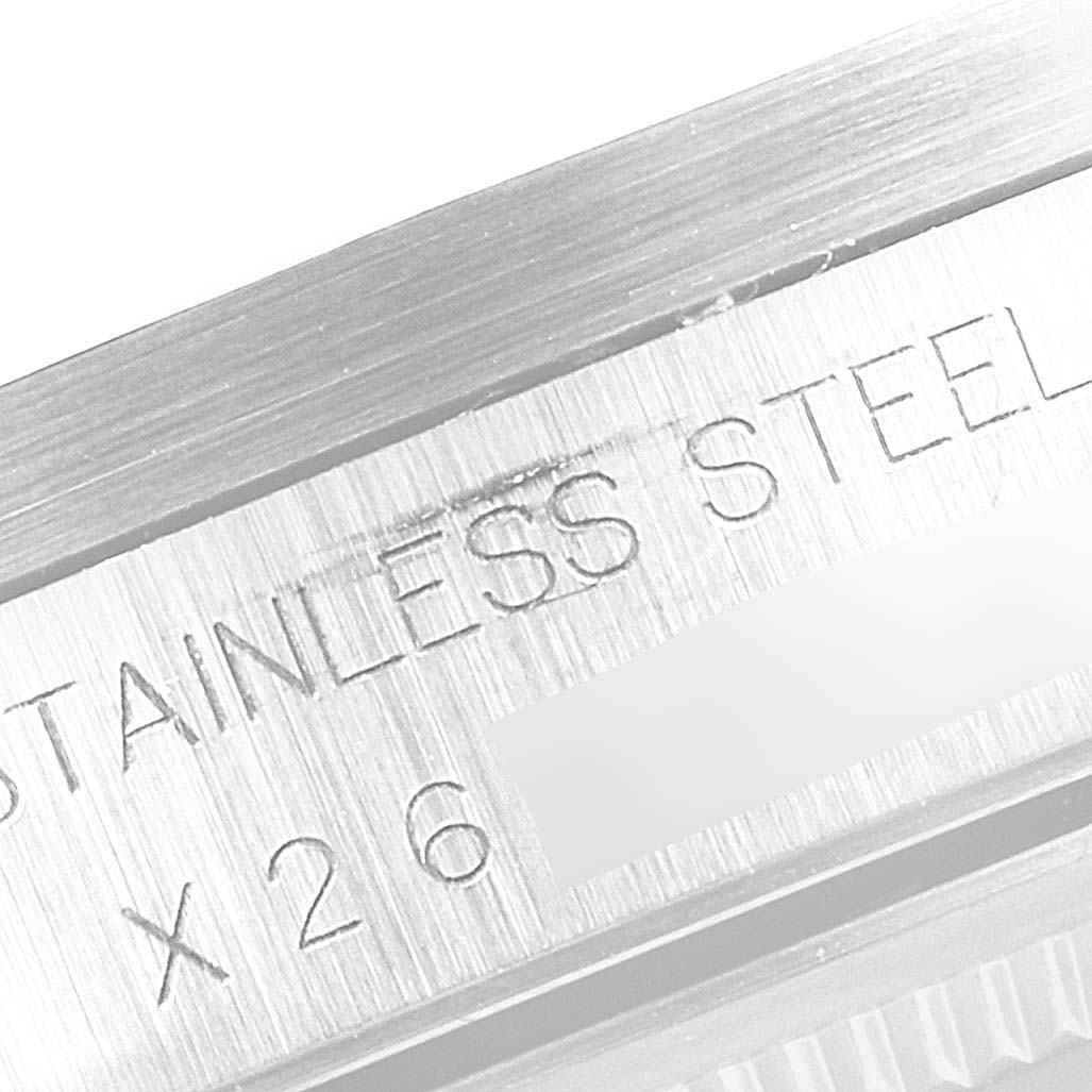 This image shows an extreme close-up of the side of a Rolex Air-King 14010 Men's Stainless Steel White Dial 14010 Men's Stainless Steel White Dial watch, focusing on the engraved "Stainless Steel" marking.