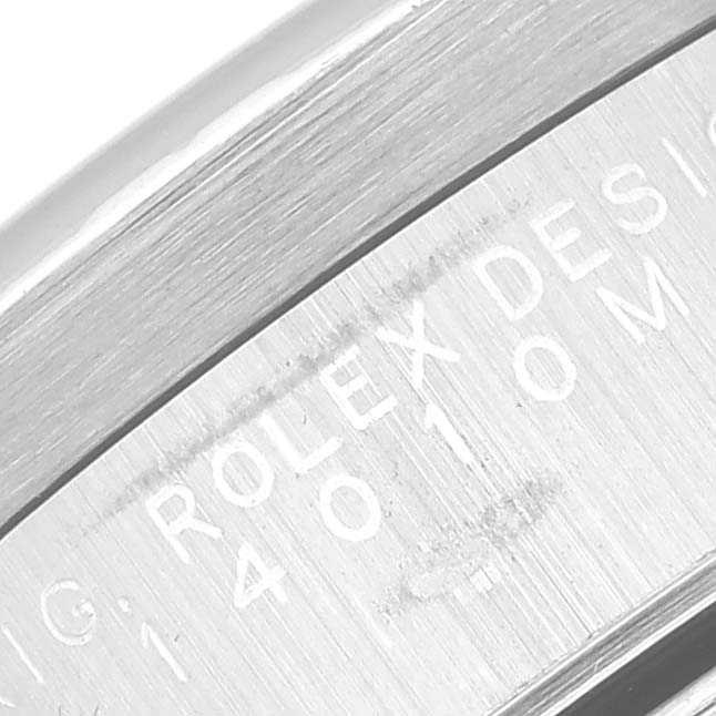 The image shows an engraved serial number on the side of the caseback of a Rolex Air-King 14010M Men's Stainless Steel Silver Dial 14010M Men's Stainless Steel Silver Dial watch.