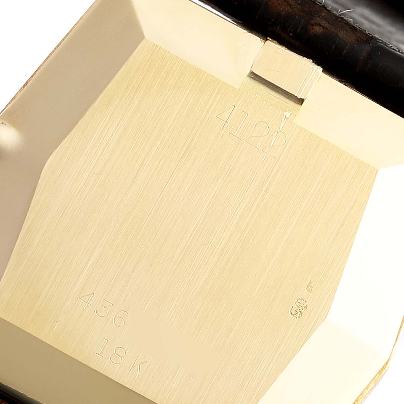 The image shows the back case of a Vintage Collection model by Rolex, displaying engravings and gold markings.