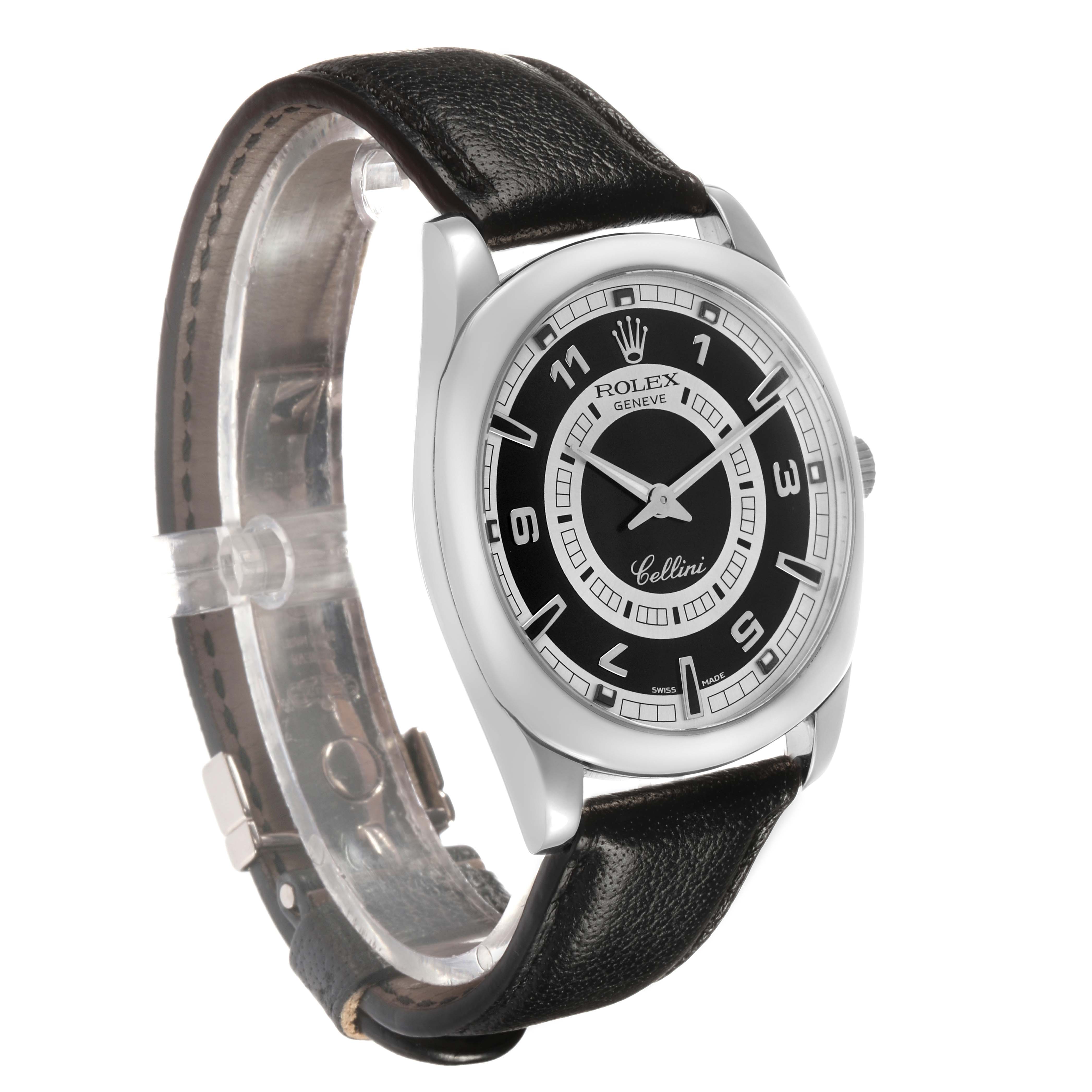 The Rolex Cellini 4243 Men's White Gold Black Dial watch is shown from a front-left angle, highlighting the black dial and leather strap.