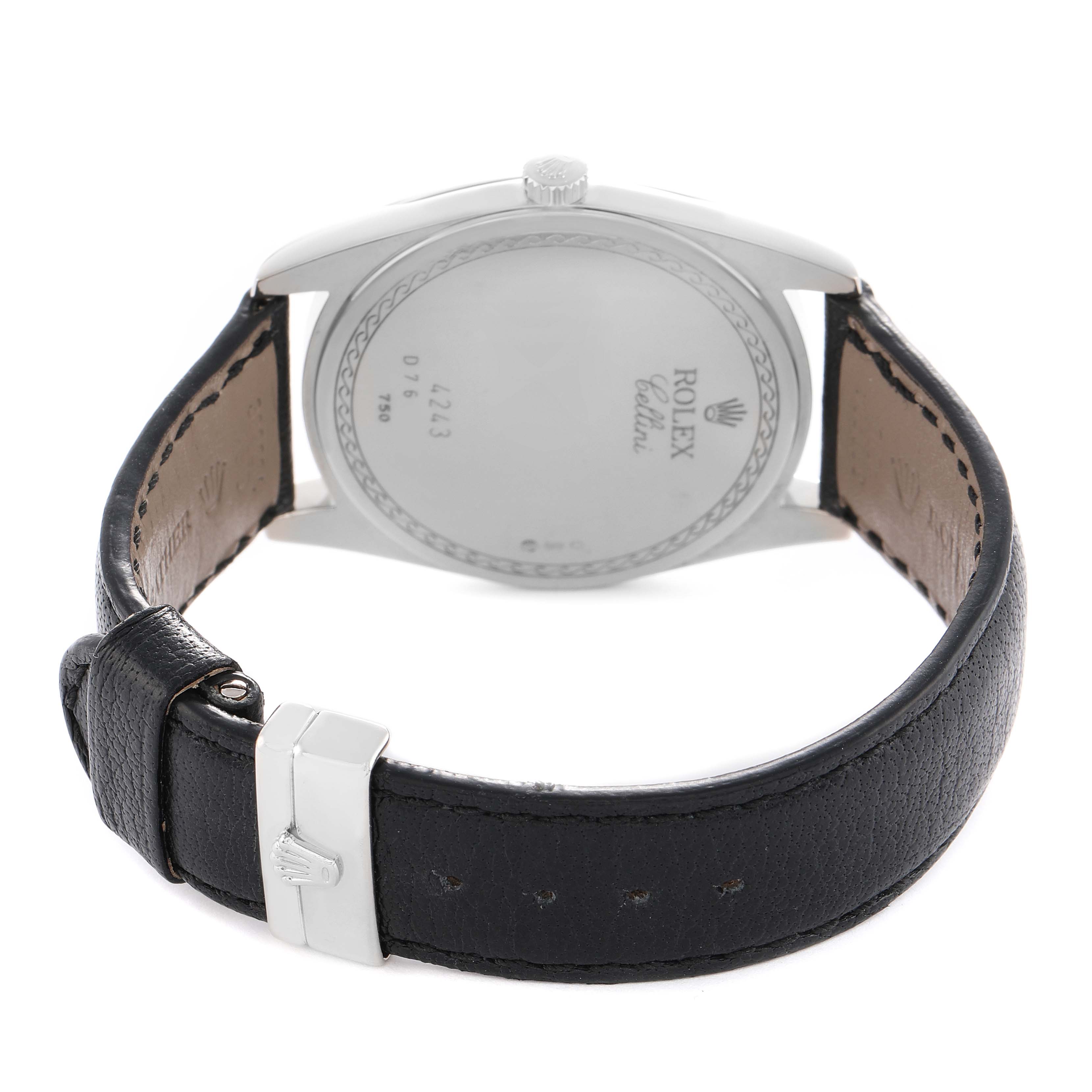 The image shows the back of a Rolex Cellini 4243 Men's White Gold Black Dial watch, highlighting the case back, strap, and buckle.
