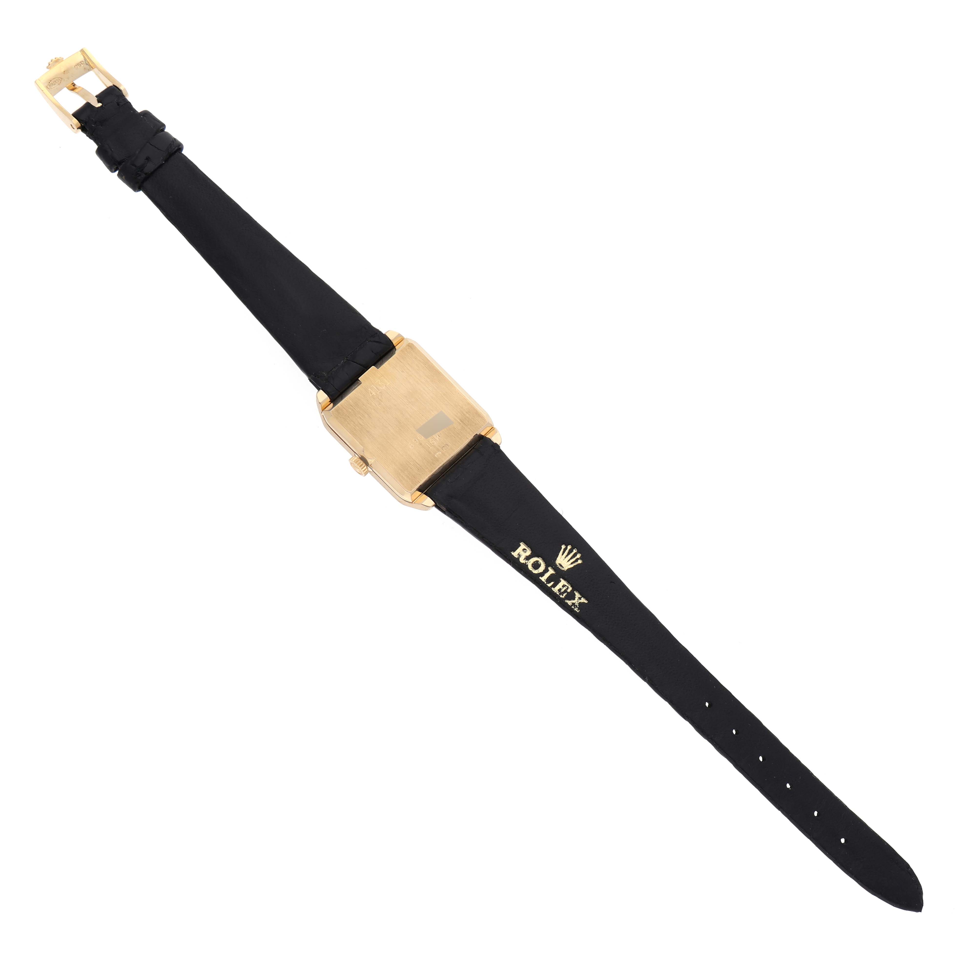 The Rolex Vintage Collection 4131 Men's Yellow Gold Champagne Dial 4131 Men's Yellow Gold Champagne Dial watch is shown from the back, displaying its gold case and black leather strap.