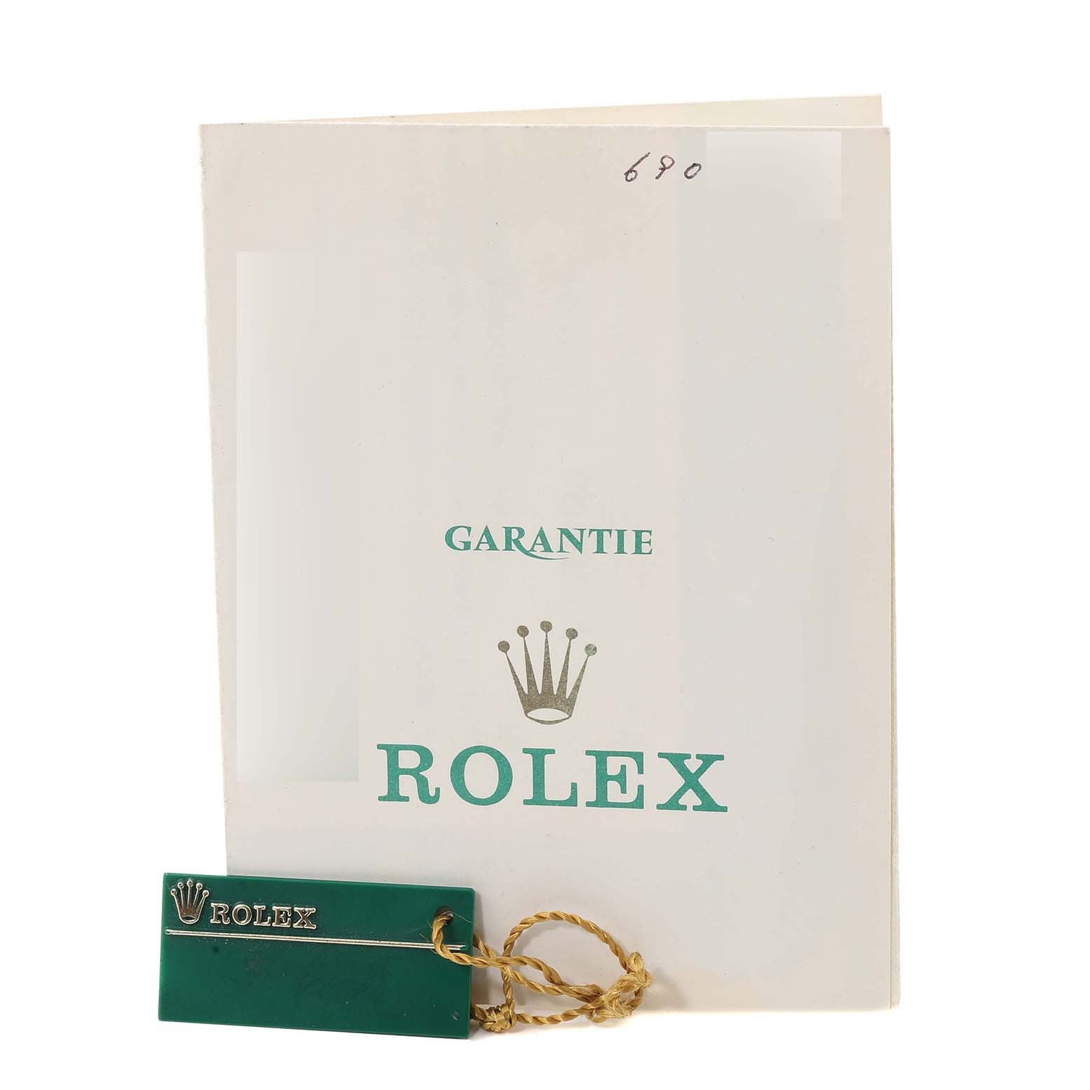 The image shows the warranty booklet and tag for a Vintage Collection Rolex watch.