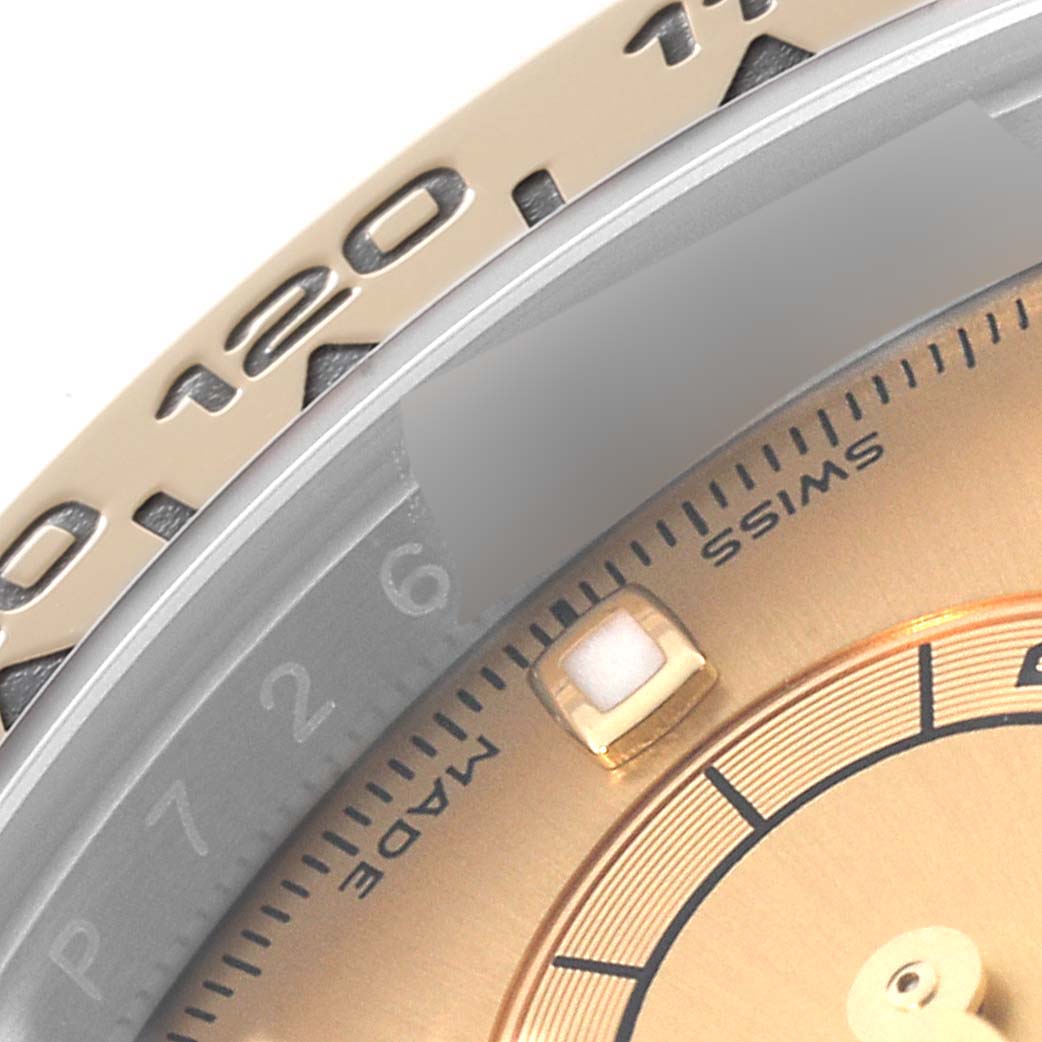 The image shows a close-up of the dial and bezel of a Rolex Daytona 116503 Men's Steel and Gold (two tone) Champagne Dial 116503 Men's Steel and Gold (two tone) Champagne Dial watch.
