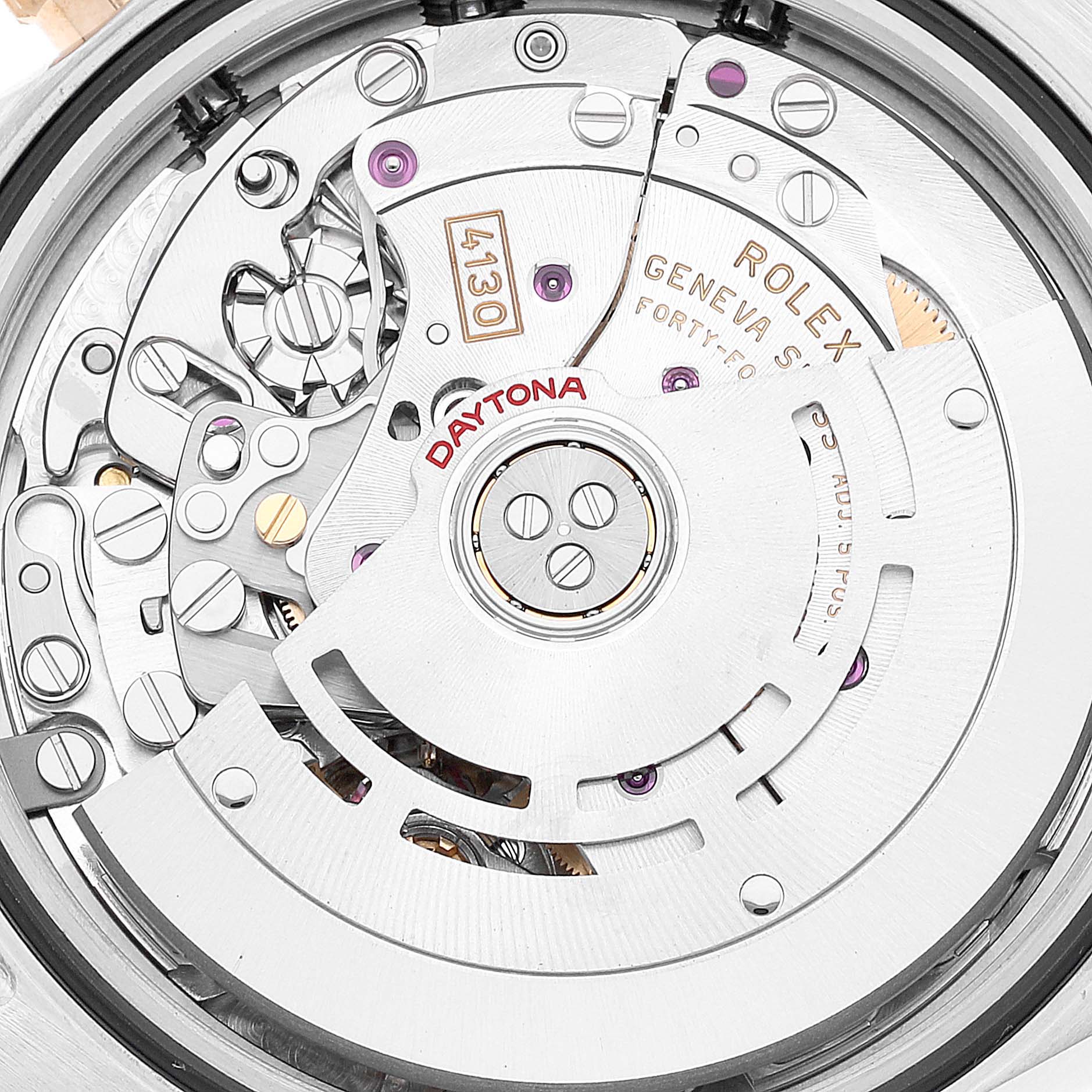 The image shows the intricate internal mechanism of a Rolex Daytona 116503 Men's Steel and Gold (two tone) Champagne Dial 116503 Men's Steel and Gold (two tone) Champagne Dial watch, featuring gears, jewels, and the oscillating weight.