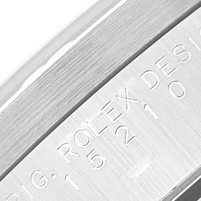 This close-up image displays part of the casing with engravings on a Rolex Date 15210 Men's Stainless Steel Black Dial 15210 Men's Stainless Steel Black Dial model watch.