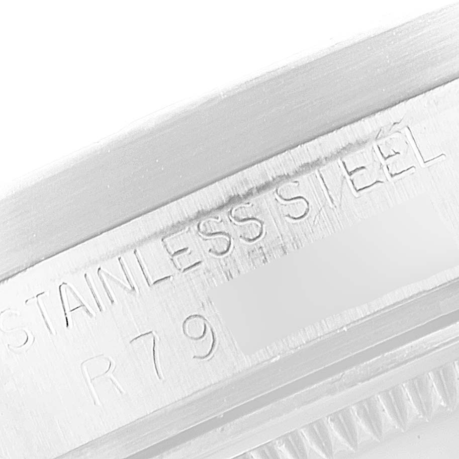 This image shows a close-up of the serial number engraved on the stainless steel case of a Rolex Date 15010 Men's Stainless Steel White Dial 15010 Men's Stainless Steel White Dial model watch.