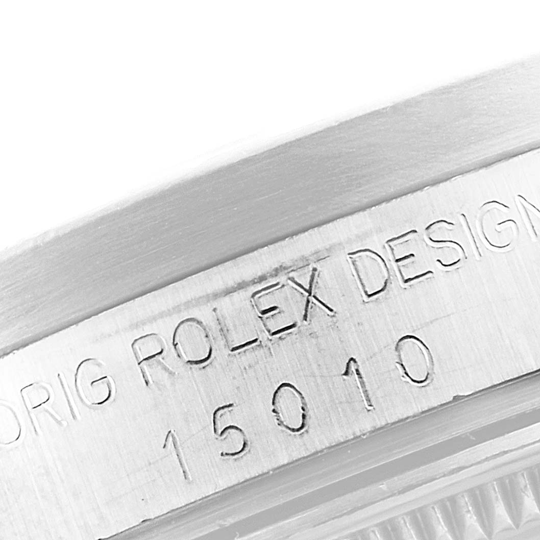 This close-up image shows the engraved side of the Rolex Date 15010 Men's Stainless Steel White Dial 15010 Men's Stainless Steel White Dial model with the serial number 15010.