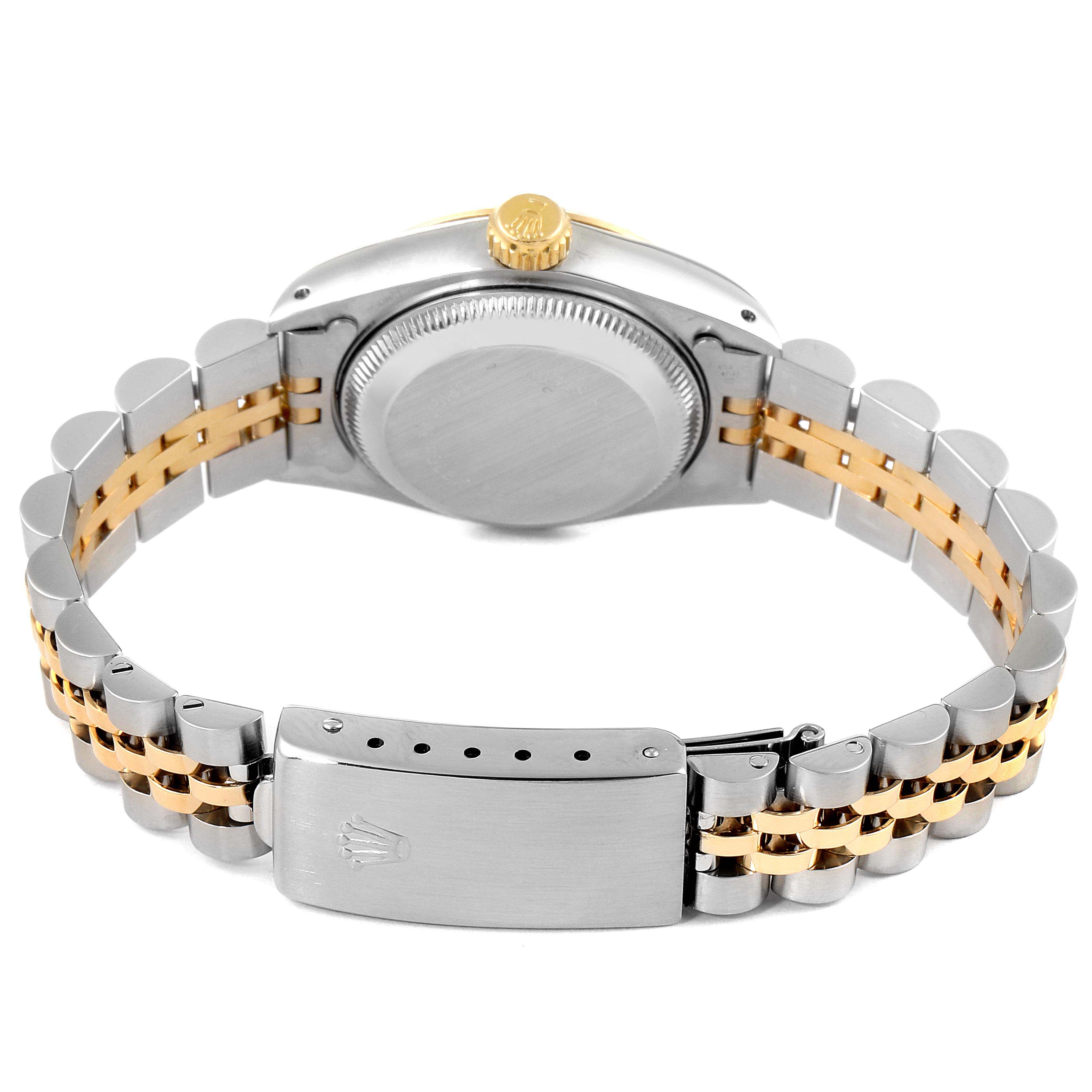 The image shows the back view of a Rolex Datejust 69173 Women
s Steel and Gold (two tone) Champagne Dial 69173 Women
s Steel and Gold (two tone) Champagne Dial watch, focusing on its stainless steel and gold bracelet and clasp.