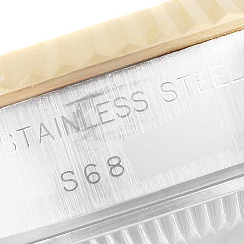 This close-up shows the engraved stainless steel part of the case on a Rolex Datejust 69173 Women
s Steel and Gold (two tone) Champagne Dial 69173 Women
s Steel and Gold (two tone) Champagne Dial watch.