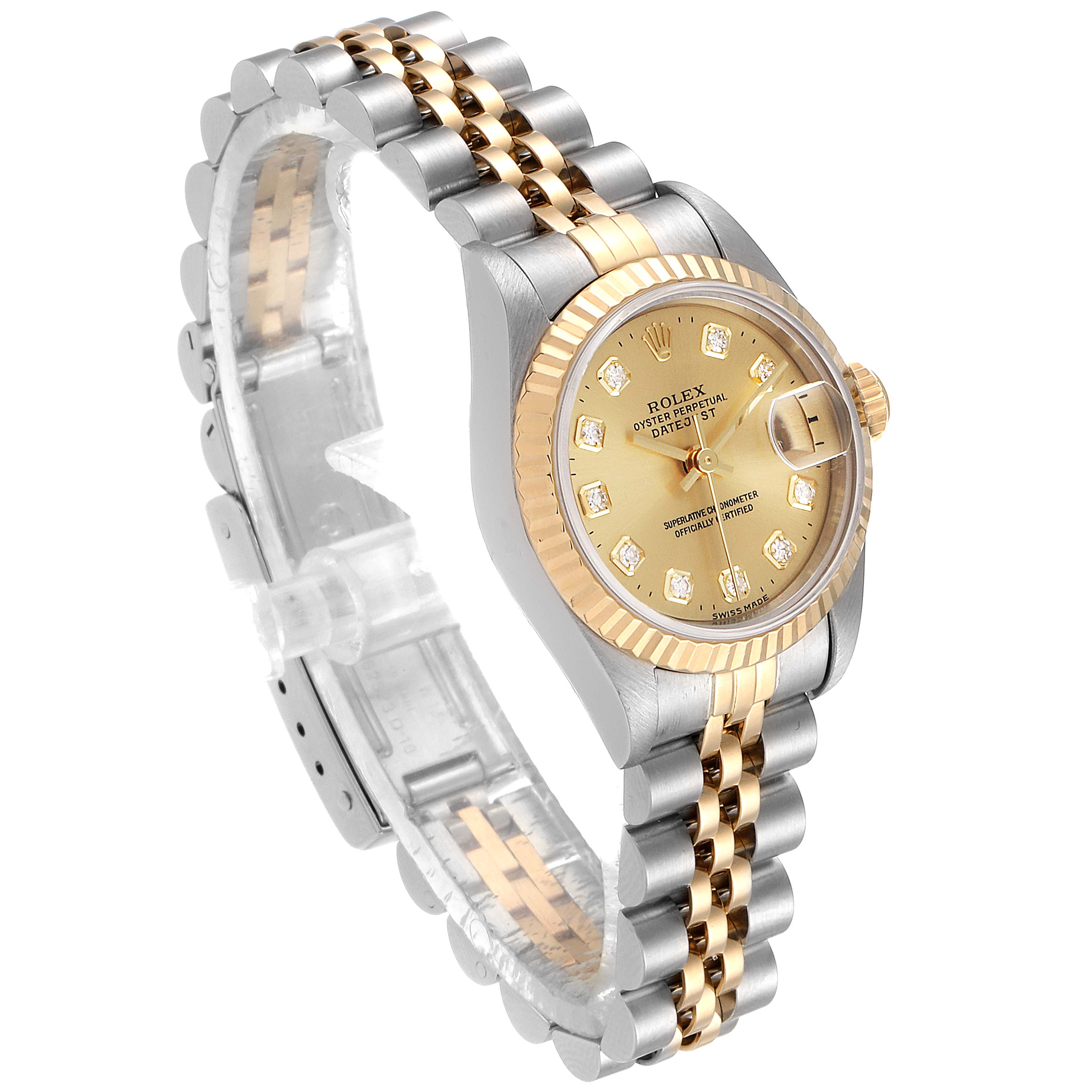 The image shows a Rolex Datejust 69173 Women
s Steel and Gold (two tone) Champagne Dial 69173 Women
s Steel and Gold (two tone) Champagne Dial watch at a three-quarter angle, highlighting its gold and silver bracelet, bezel, and diamanté dial.