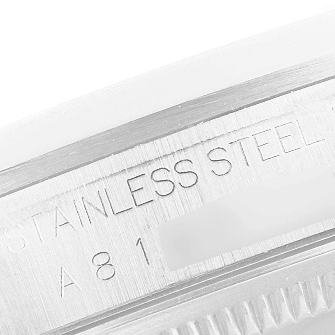 This image shows a close-up view of the stainless steel engraving on the edge of a Rolex Datejust 16200 Men's Stainless Steel Black Dial 16200 Men's Stainless Steel Black Dial watch.