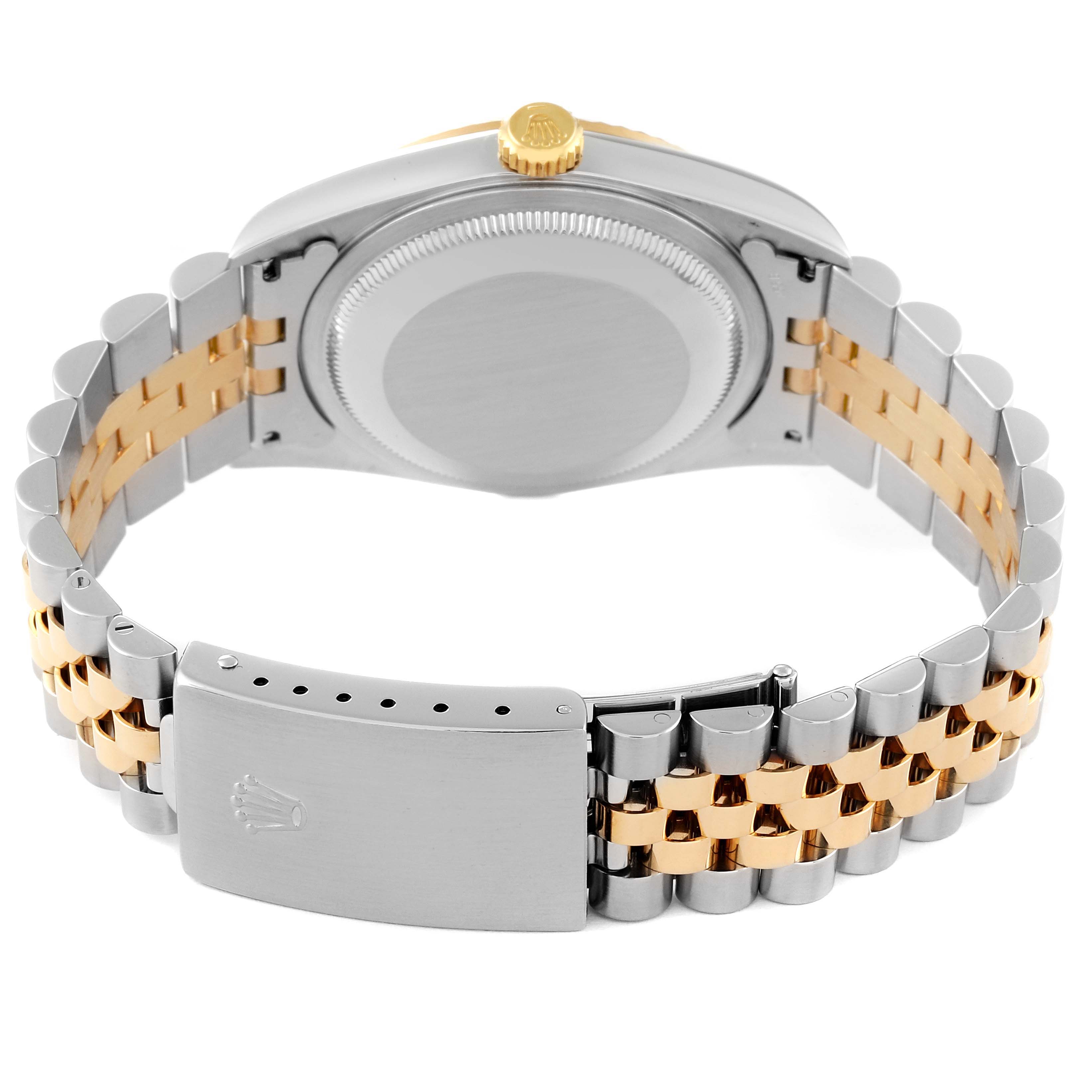 This image shows the back side, clasp, and bracelet of a Rolex Datejust 16233 Men's Steel and Gold (two tone) Blue Dial 16233 Men's Steel and Gold (two tone) Blue Dial watch.