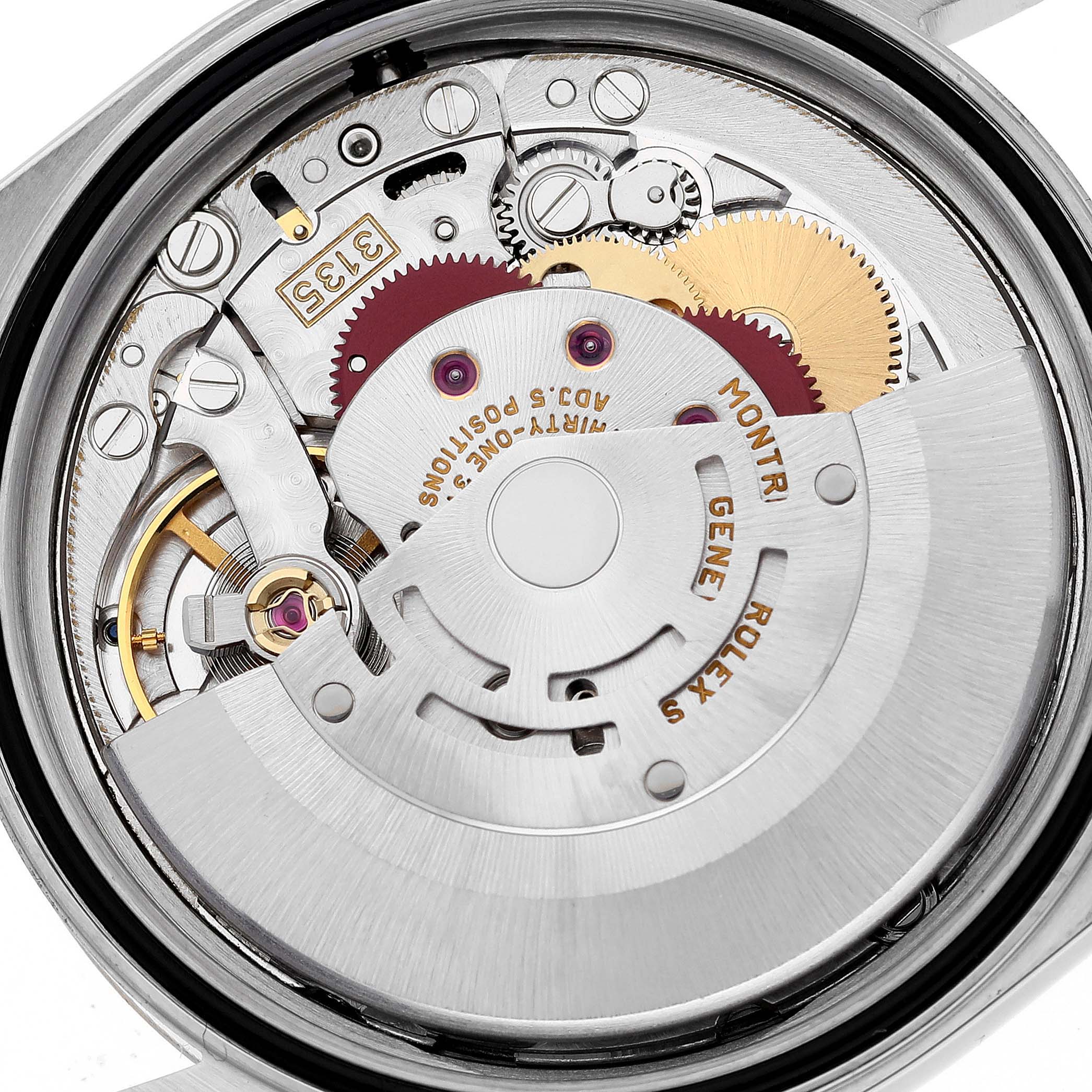 This image shows the intricate internal mechanism of a Rolex Datejust 16233 Men's Steel and Gold (two tone) Blue Dial 16233 Men's Steel and Gold (two tone) Blue Dial watch, highlighting gears, cogs, and the rotor.