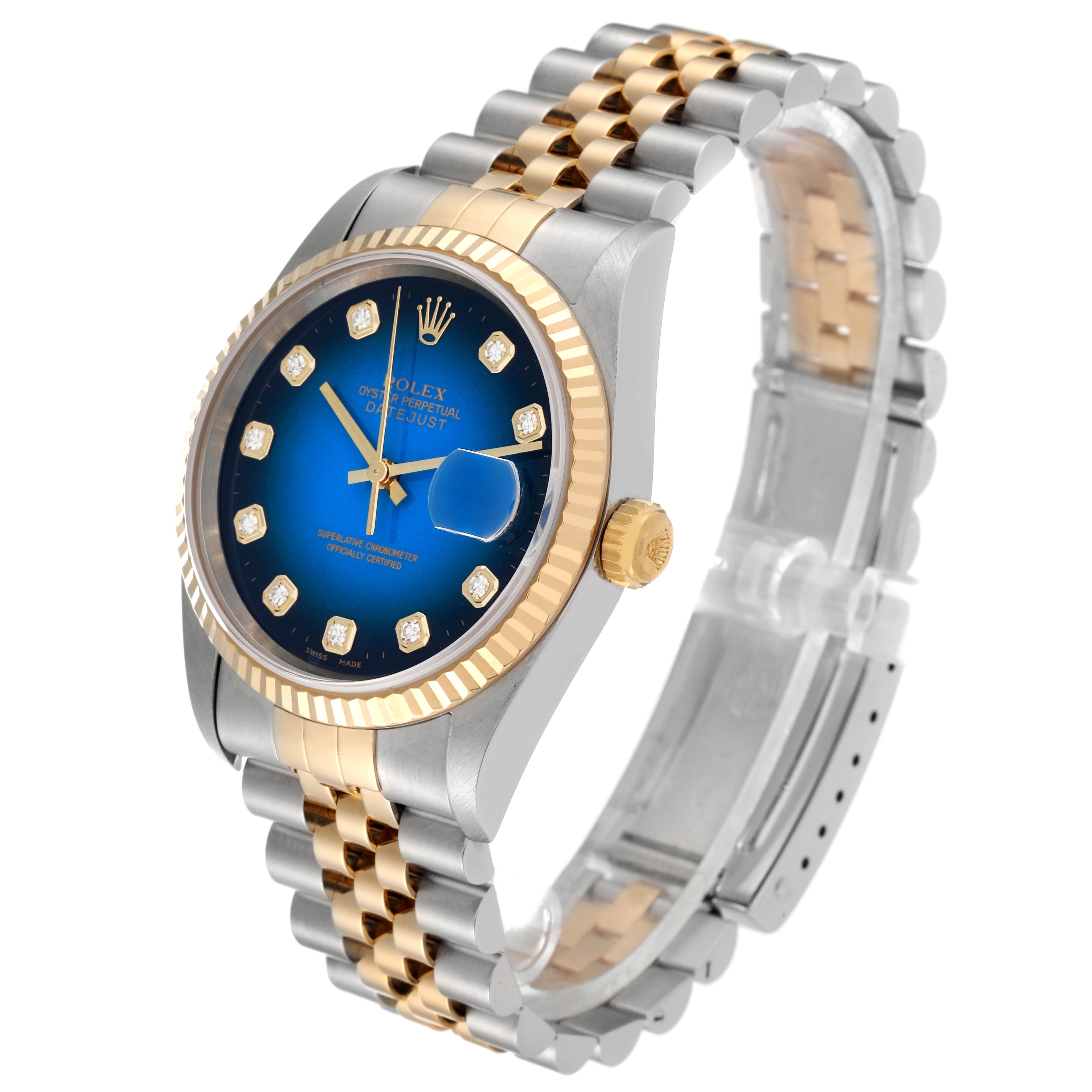 This Rolex Datejust 16233 Men's Steel and Gold (two tone) Blue Dial 16233 Men's Steel and Gold (two tone) Blue Dial watch is shown at an angled view highlighting its gold and stainless steel band, fluted bezel, and blue dial.