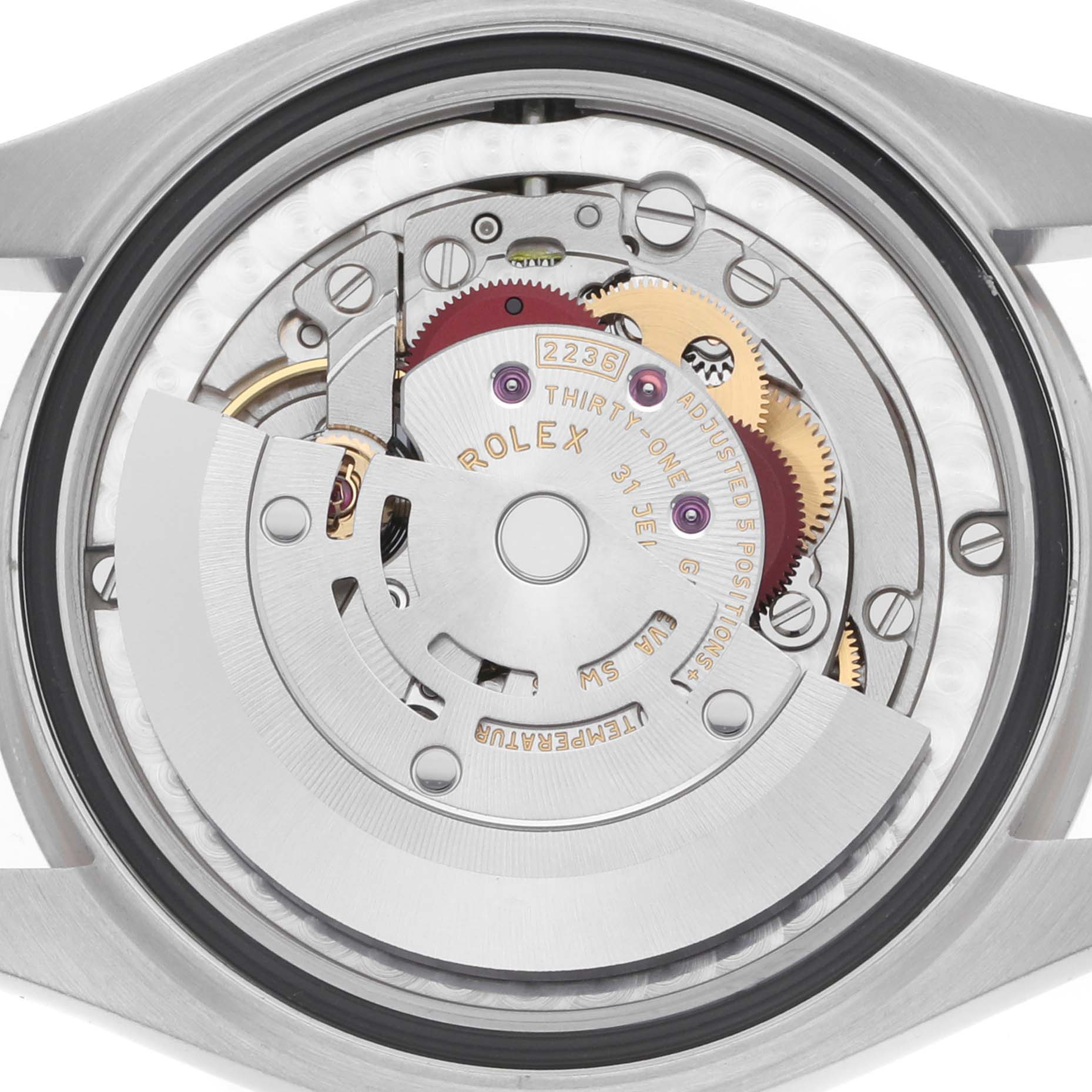 The image shows the back view of a Rolex Mid-Size 278274 Women's Stainless Steel Black Dial watch, highlighting its intricate internal movement mechanism.