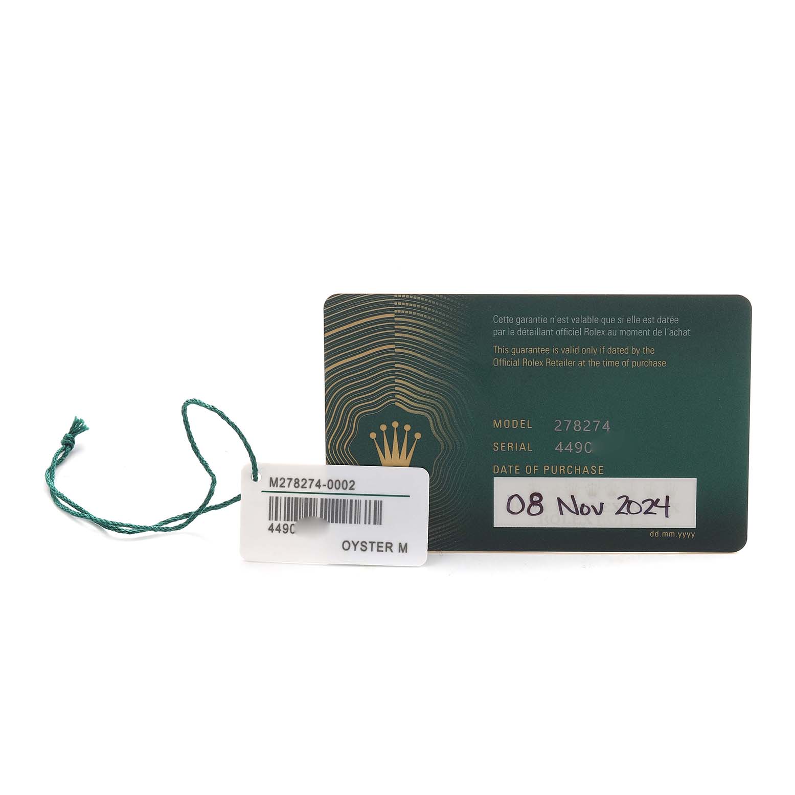 The image shows the warranty card and tag for a mid-size Rolex model, featuring the model number and purchase date.