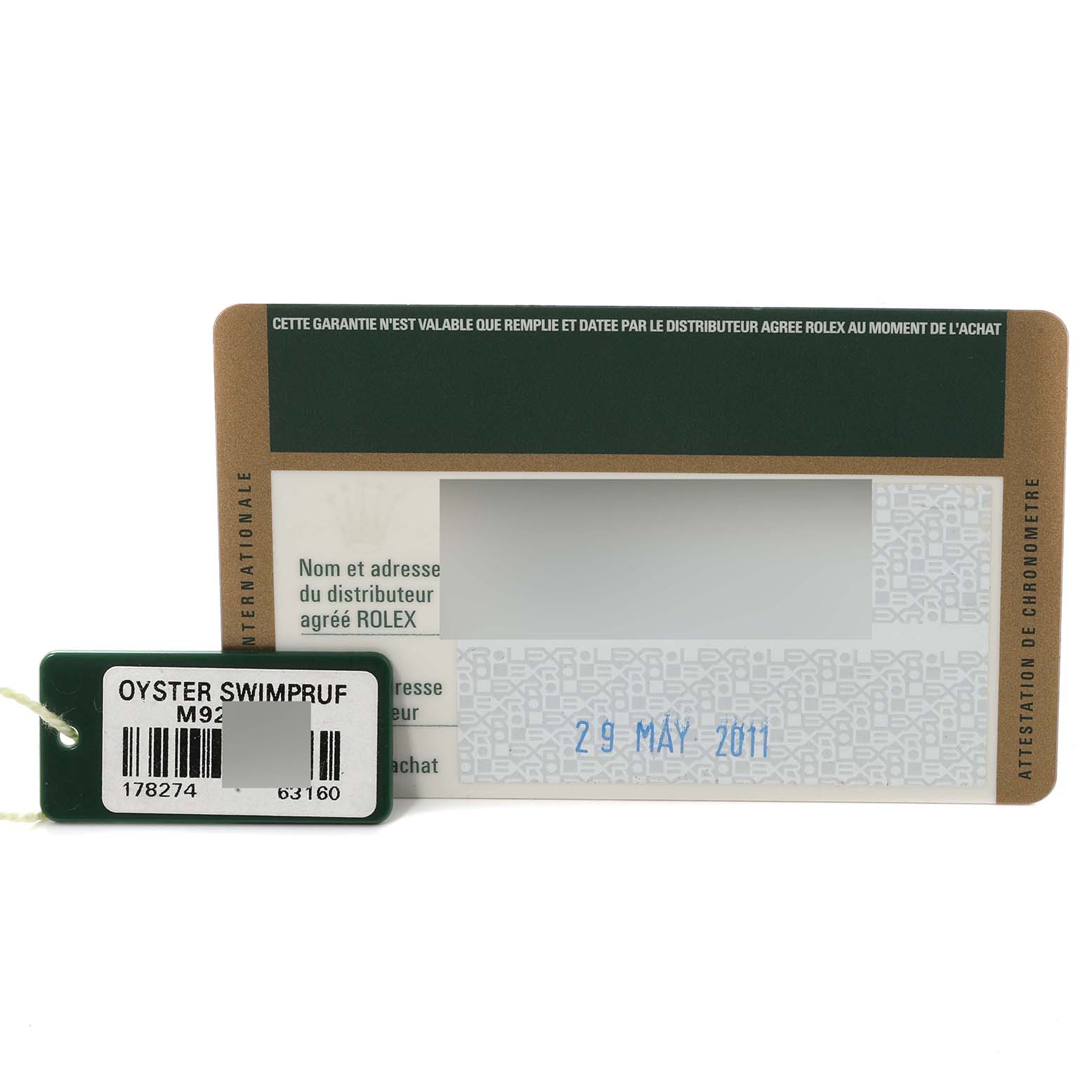 This image shows the warranty card and a tag for a Rolex Mid-Size 178274 Women
s Stainless Steel Blue Dial 178274 Women
s Stainless Steel Blue Dial Oyster Swimpruf watch, with the card dated 29 May 2011.