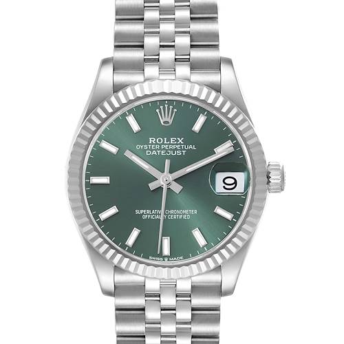 The Rolex Mid-Size Datejust watch is shown from a frontal view, highlighting its green dial, fluted bezel, and Jubilee bracelet.