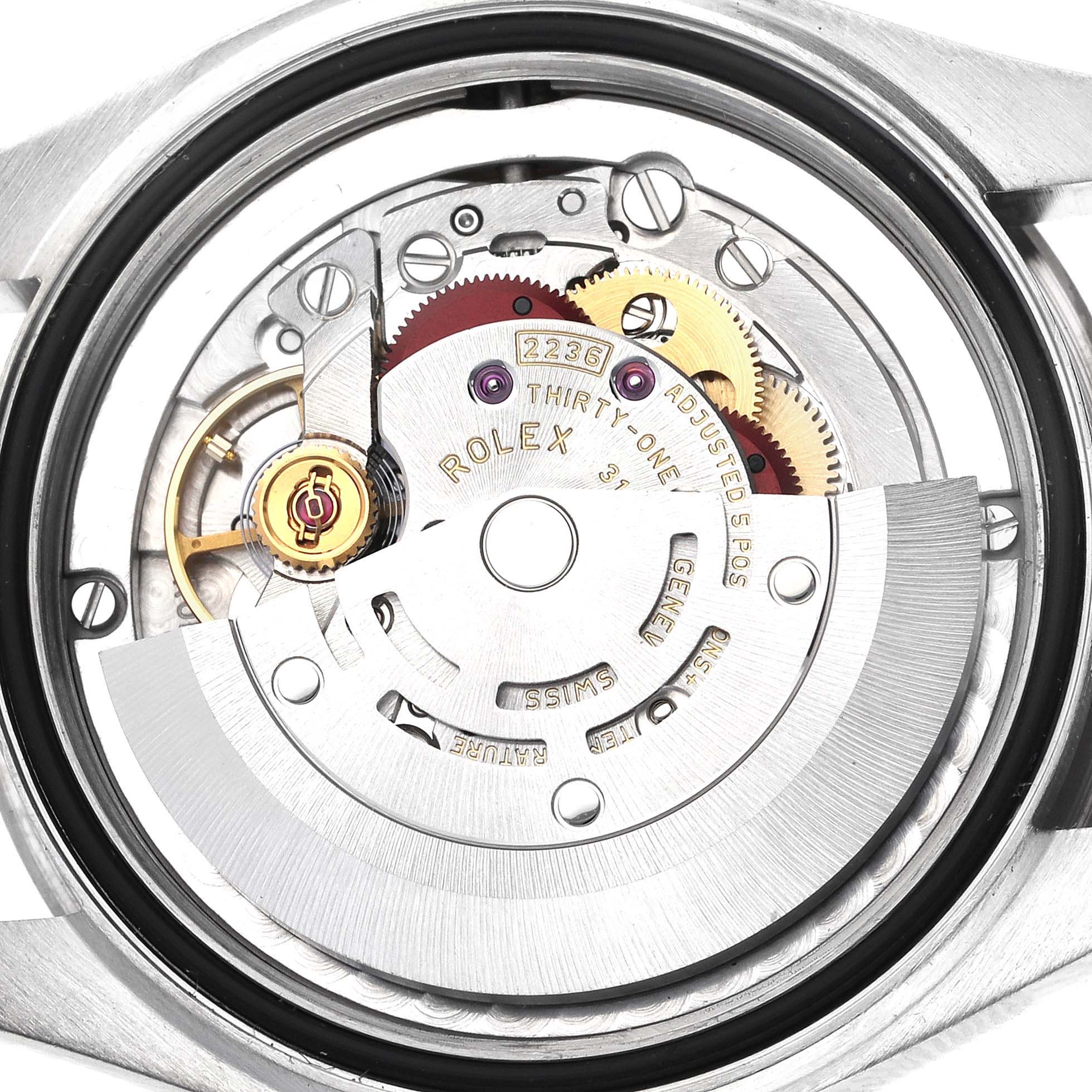 The image shows the movement of a Rolex Mid-Size 278274 Women's Stainless Steel Green Dial 278274 Women's Stainless Steel Green Dial watch from a caseback angle, highlighting its intricate mechanics.