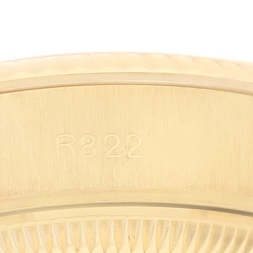 This is a close-up of the engraved side of the bezel or case of a Rolex President 69178 Women's Yellow Gold Champagne Dial 69178 Women's Yellow Gold Champagne Dial model watch.