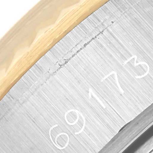 The image shows a close-up of the side of the Rolex Datejust 69173 Women's Steel and Gold (two tone) Silver Dial 69173 Women's Steel and Gold (two tone) Silver Dial, focusing on the case edge with the model number 69173.