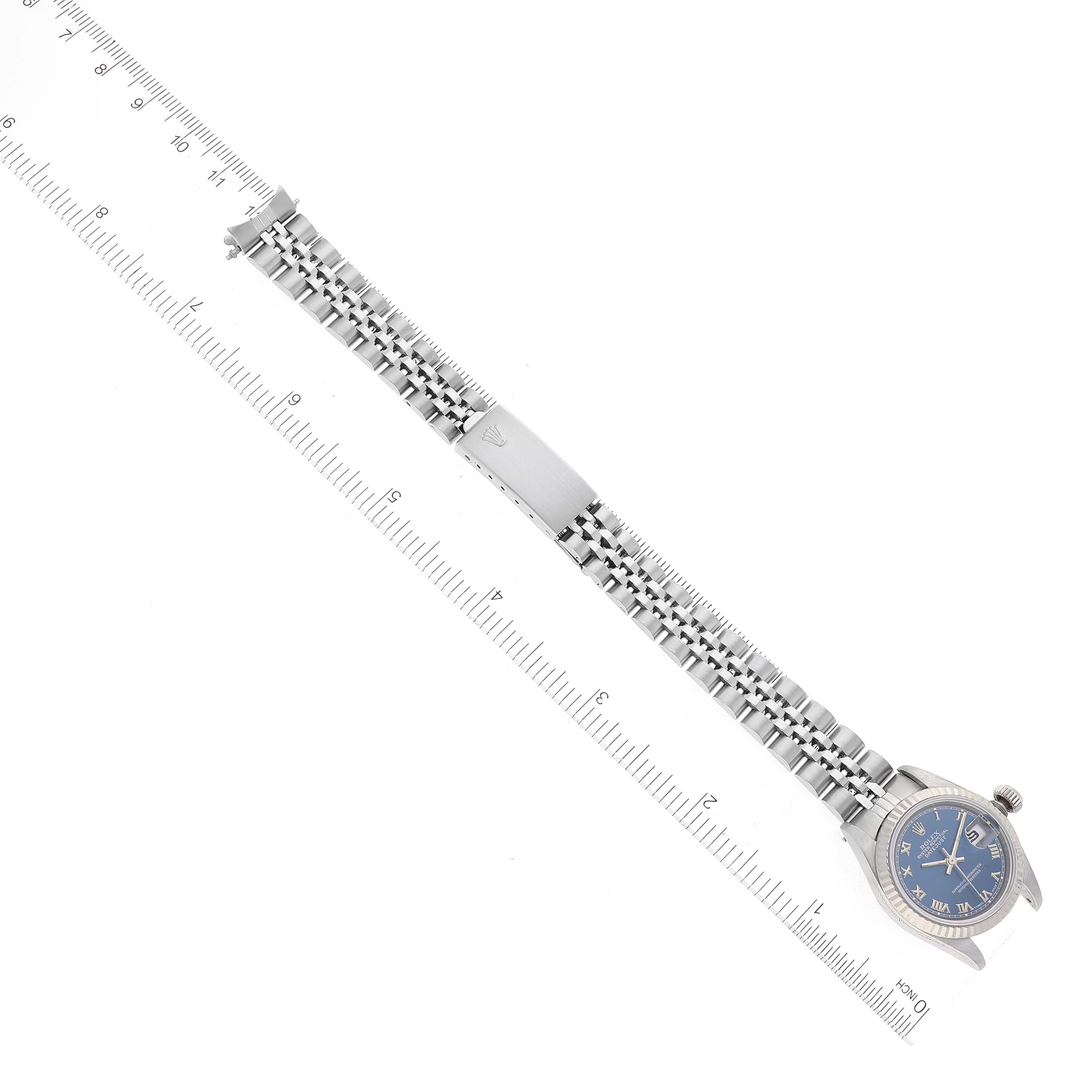 This image shows a Rolex Datejust 69174 Women's Stainless Steel Blue Dial 69174 Women's Stainless Steel Blue Dial watch, laid flat with its bracelet extended, measured by a ruler.