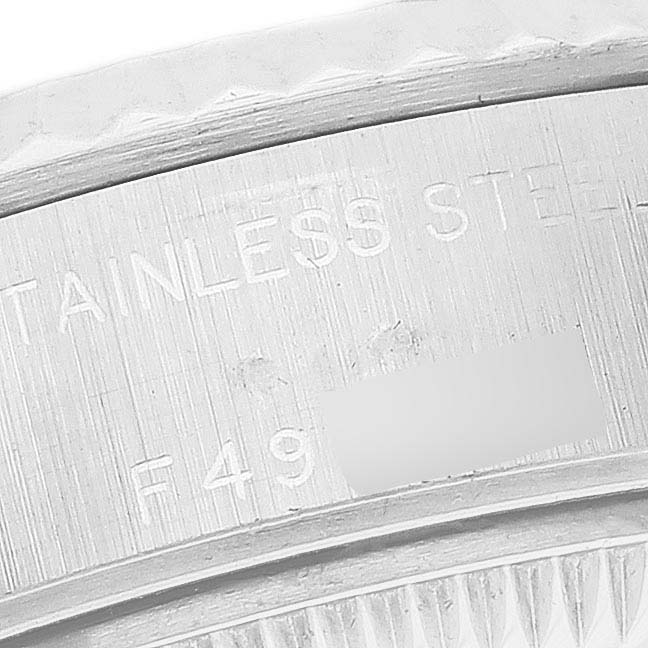 This image shows a close-up of the side engraving on the bezel of a Rolex Datejust 79174 Women's Stainless Steel Mother of Pearl Dial 79174 Women's Stainless Steel Mother of Pearl Dial watch, emphasizing "STAINLESS STEEL."
