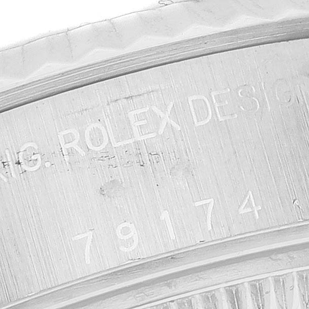 This image shows a close-up of the serial number engraving on the case of a Rolex Datejust 79174 Women's Stainless Steel Mother of Pearl Dial 79174 Women's Stainless Steel Mother of Pearl Dial watch.