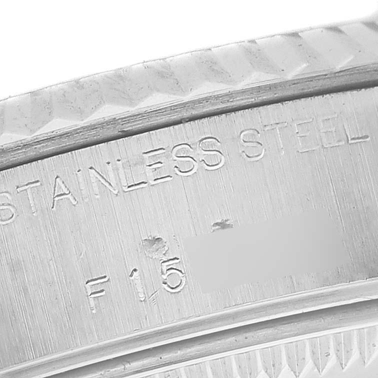 The image shows a close-up of the stainless steel bezel edge and inner engraving of a Rolex Datejust 79174 Women's Stainless Steel Mother of Pearl Dial 79174 Women's Stainless Steel Mother of Pearl Dial watch.